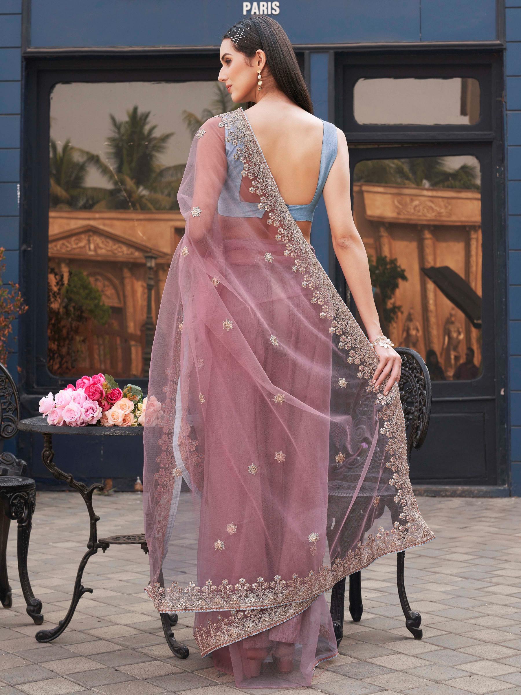 Pink colored embroidered net saree