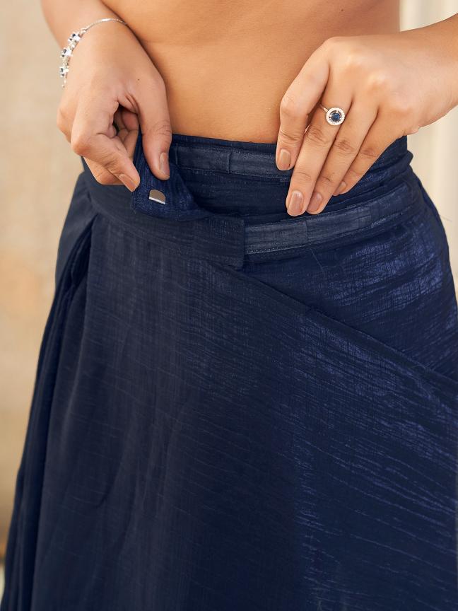 Ready to wear navy blue colored shimmer saree with tassles on pallu