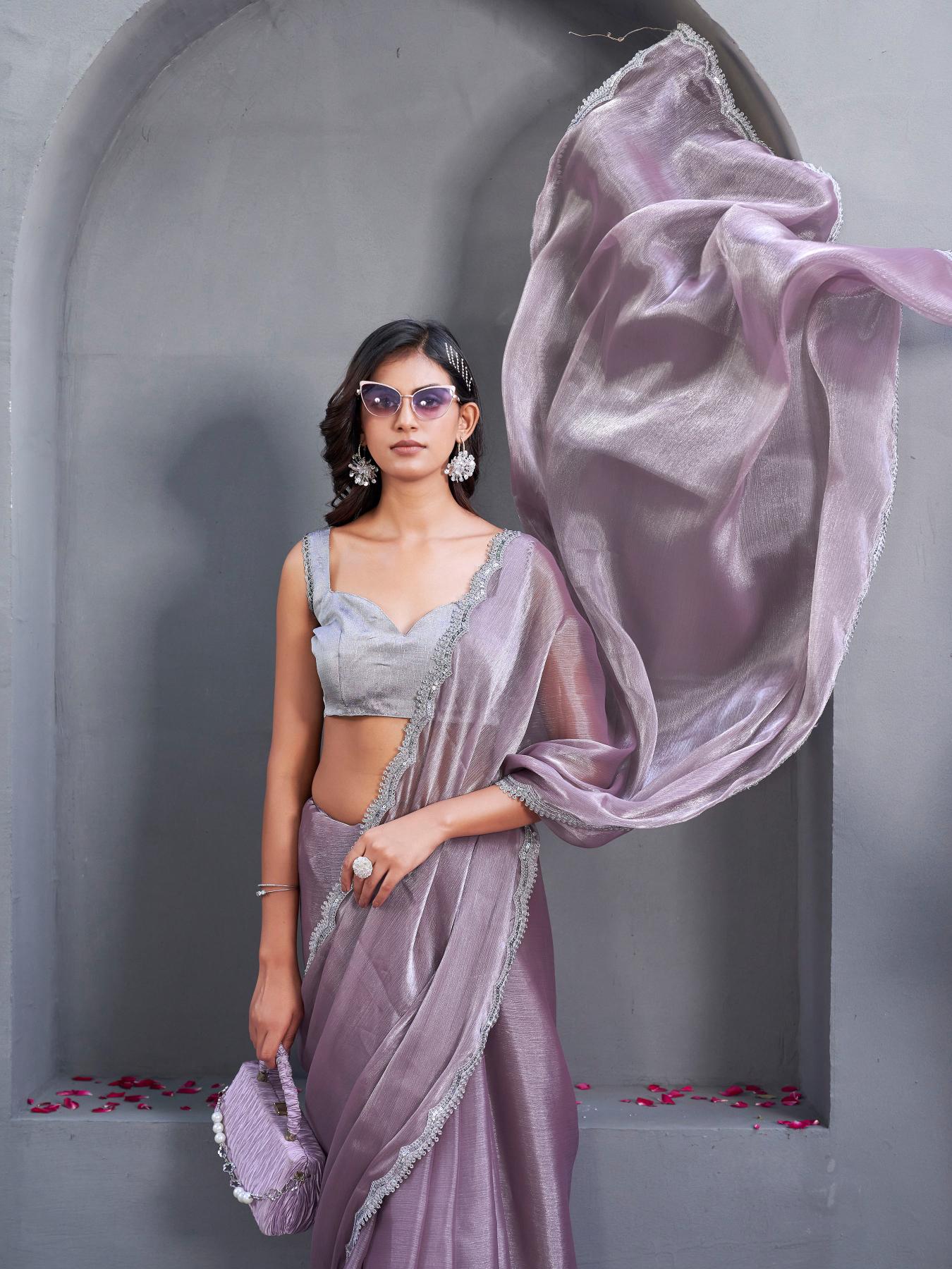 gold colored designer shimmer net saree with mirror work border