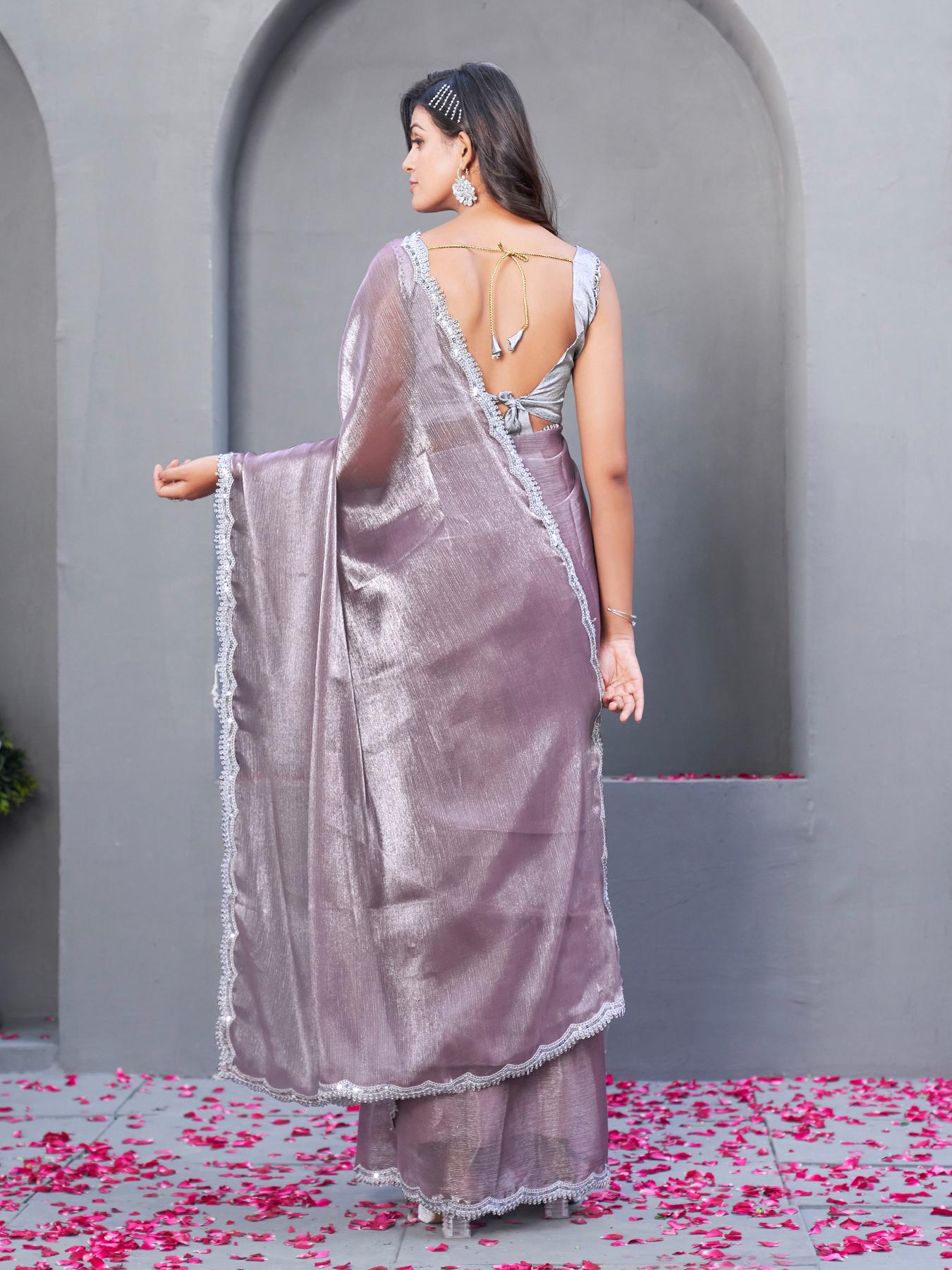 gold colored designer shimmer net saree with mirror work border