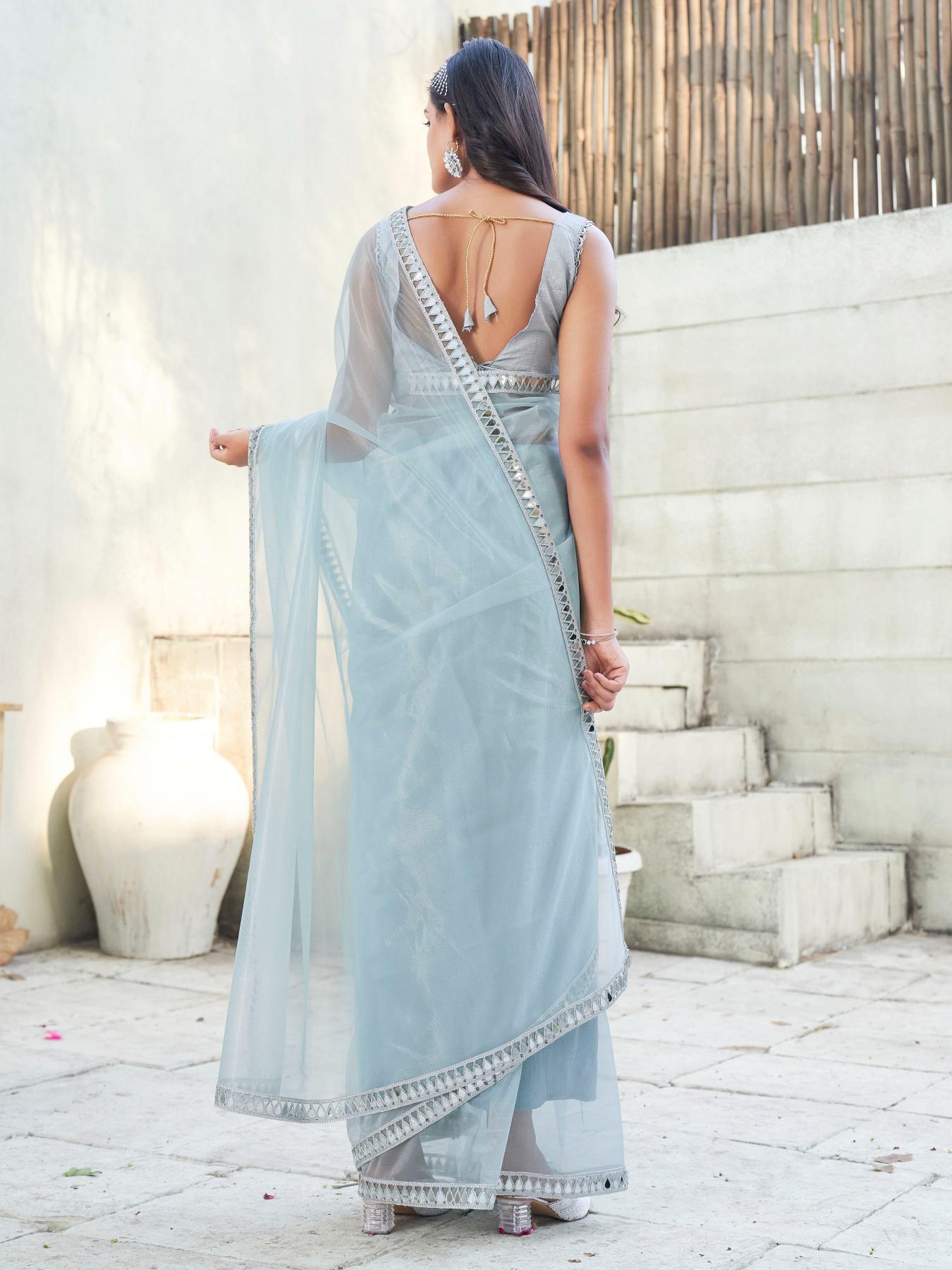 Blue colored designer shimmer net saree with mirror work border