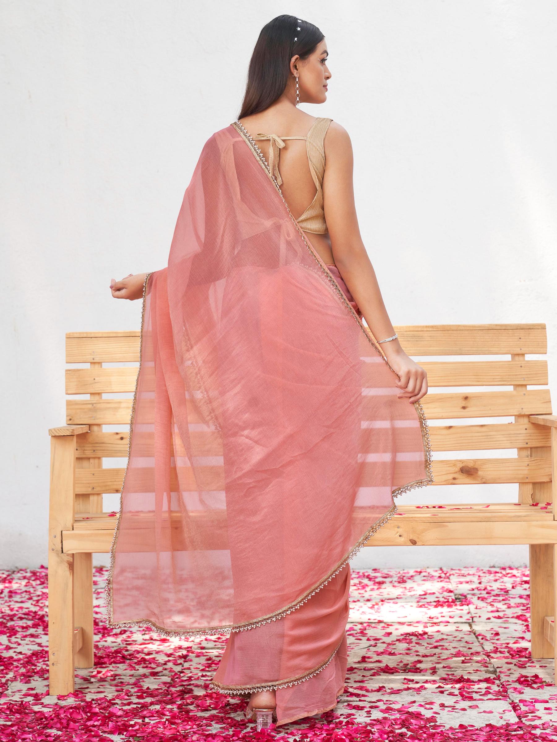 Peach colored chinon saree with embellished lace and brocade blouse