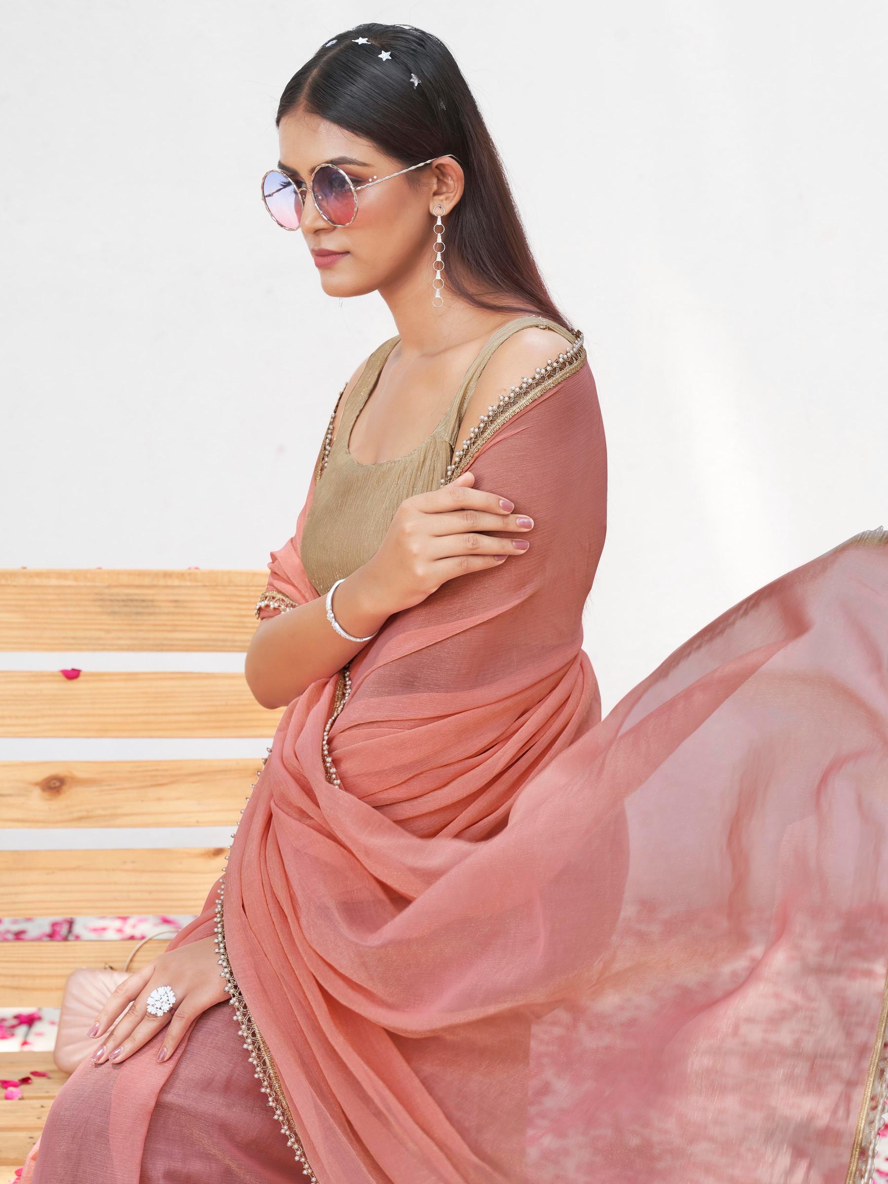 Peach colored chinon saree with embellished lace and brocade blouse