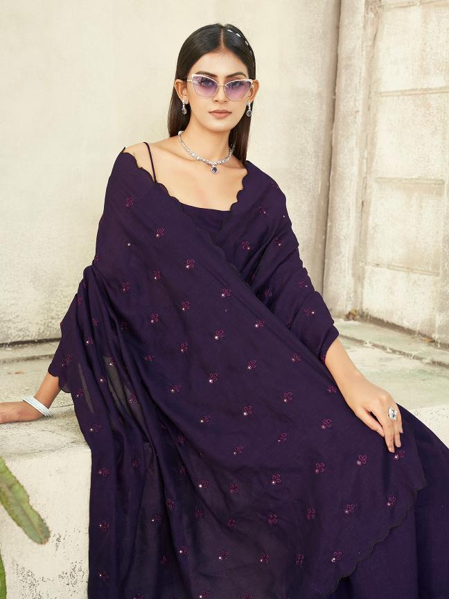 purple colored saree with mirror embroidery on pallu and scalloped border