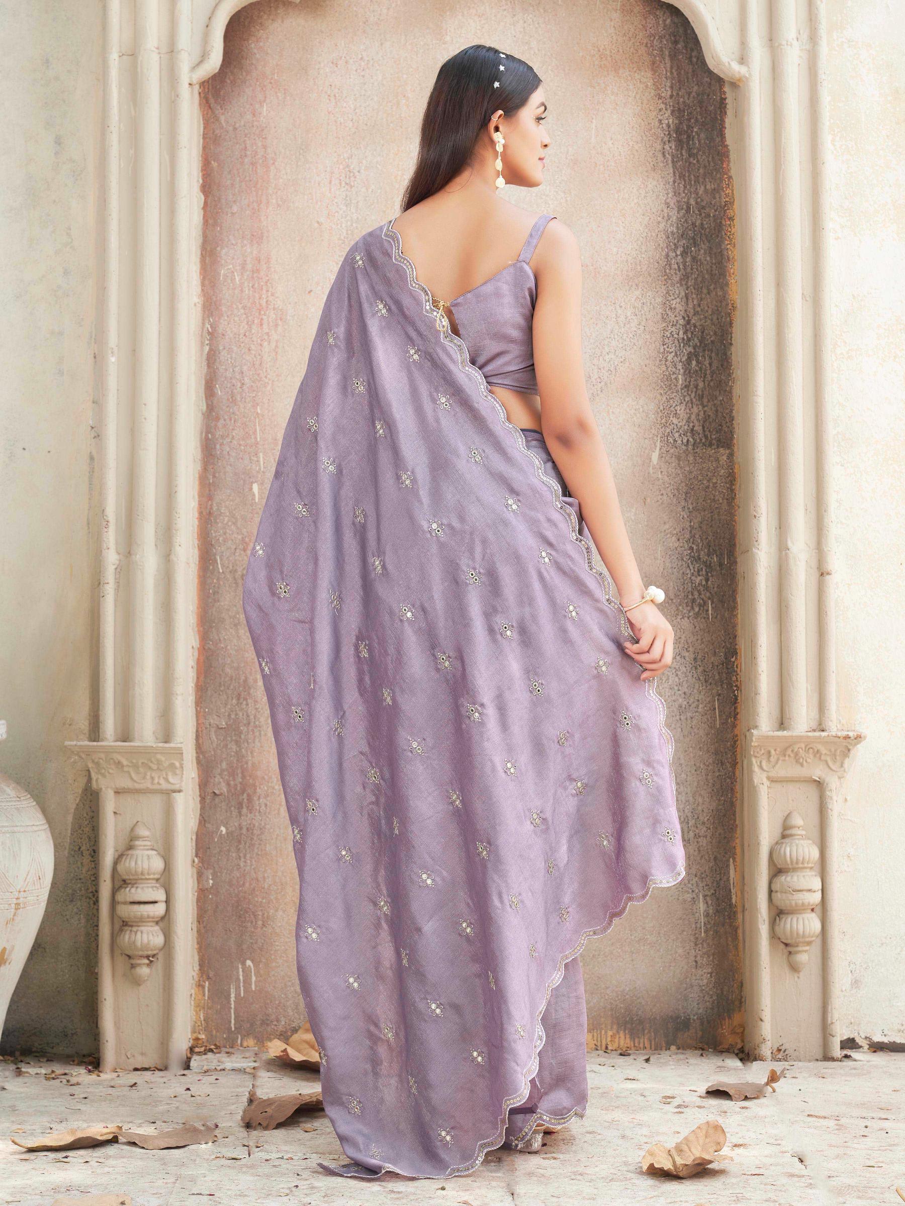 mauve colored saree with mirror embroidery on pallu and scalloped border