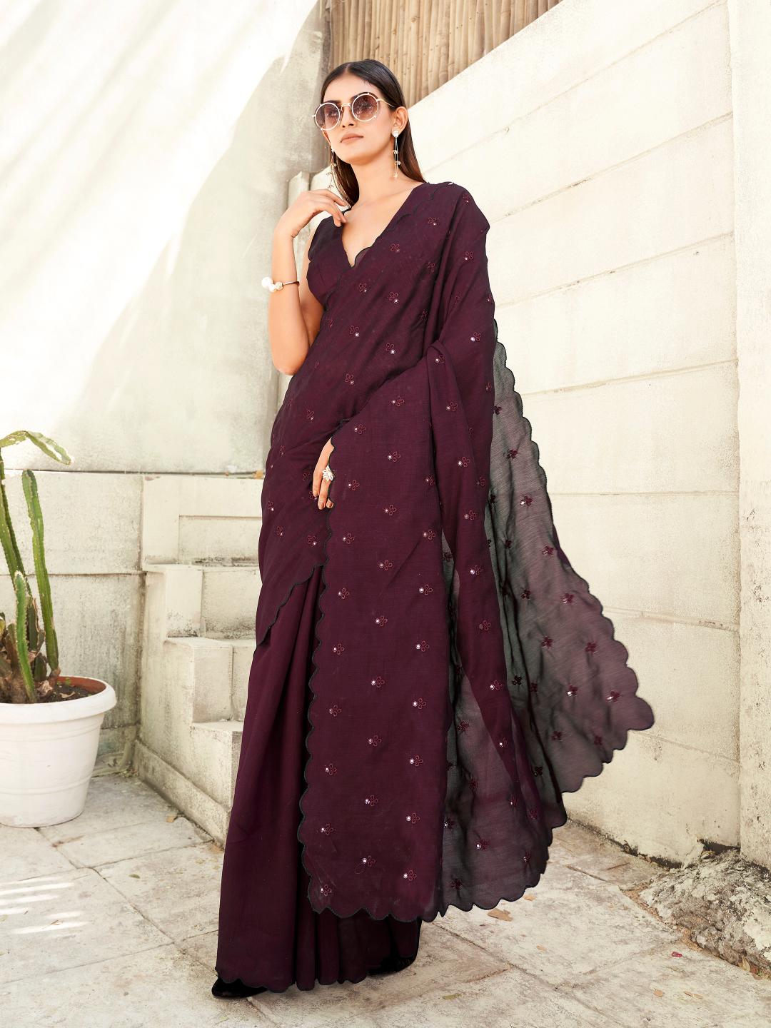 maroon colored saree with mirror embroidery on pallu and scalloped border