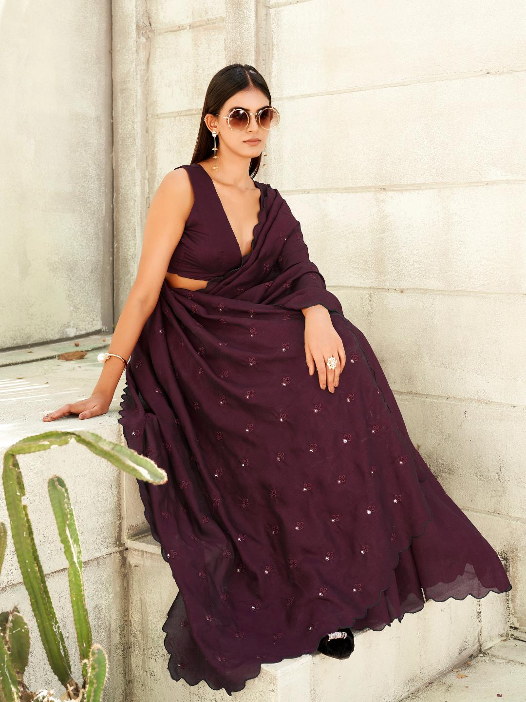 maroon colored saree with mirror embroidery on pallu and scalloped border