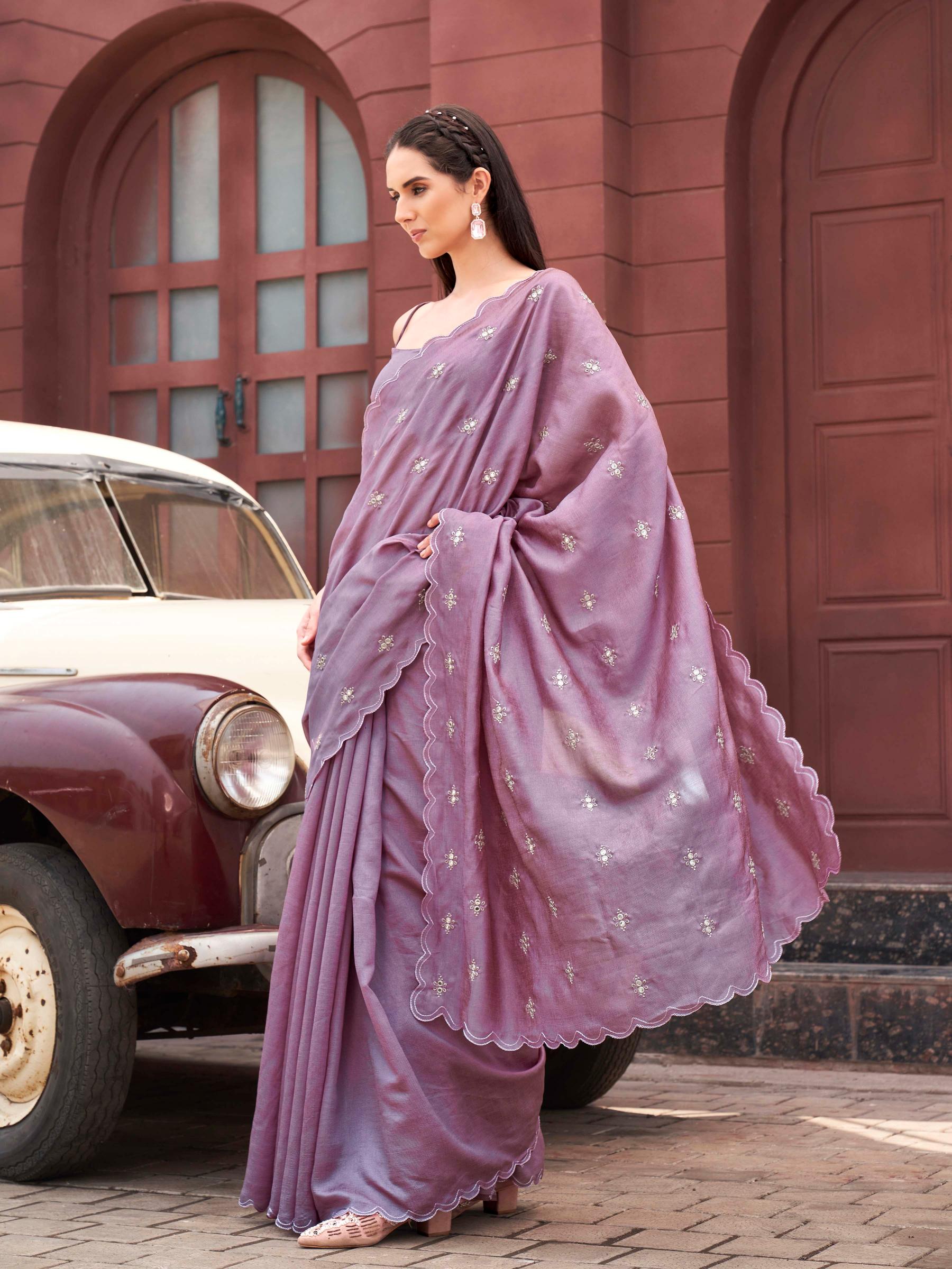 Pink colored saree with mirror embroidery on pallu and scalloped border