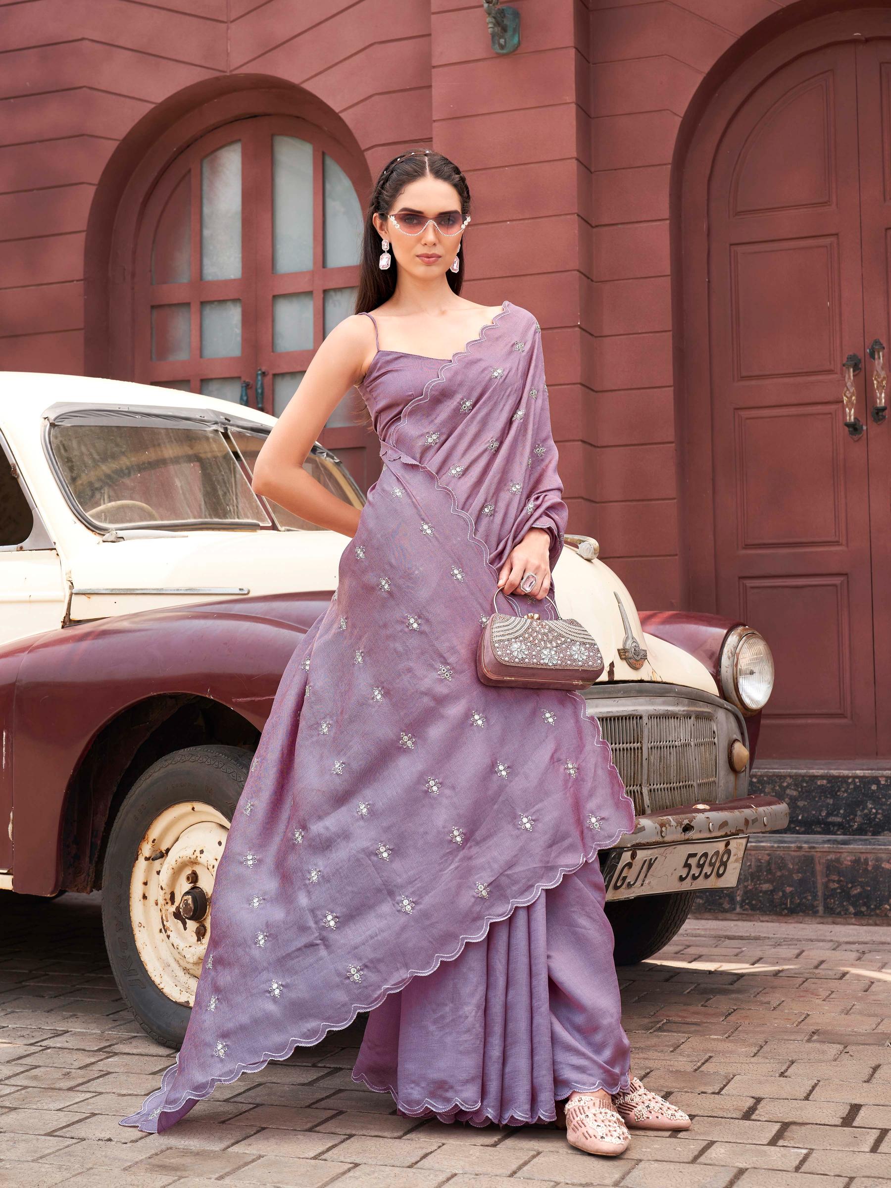 Pink colored saree with mirror embroidery on pallu and scalloped border
