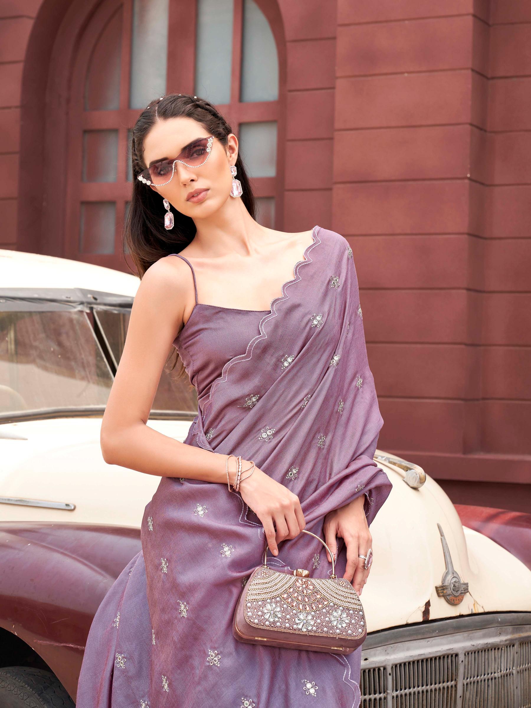 Pink colored saree with mirror embroidery on pallu and scalloped border