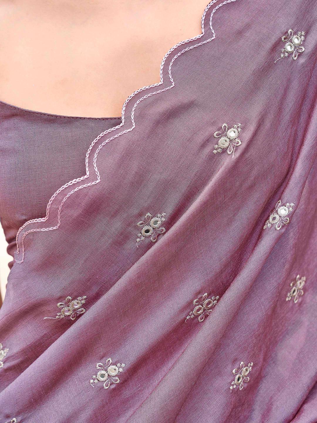 Pink colored saree with mirror embroidery on pallu and scalloped border