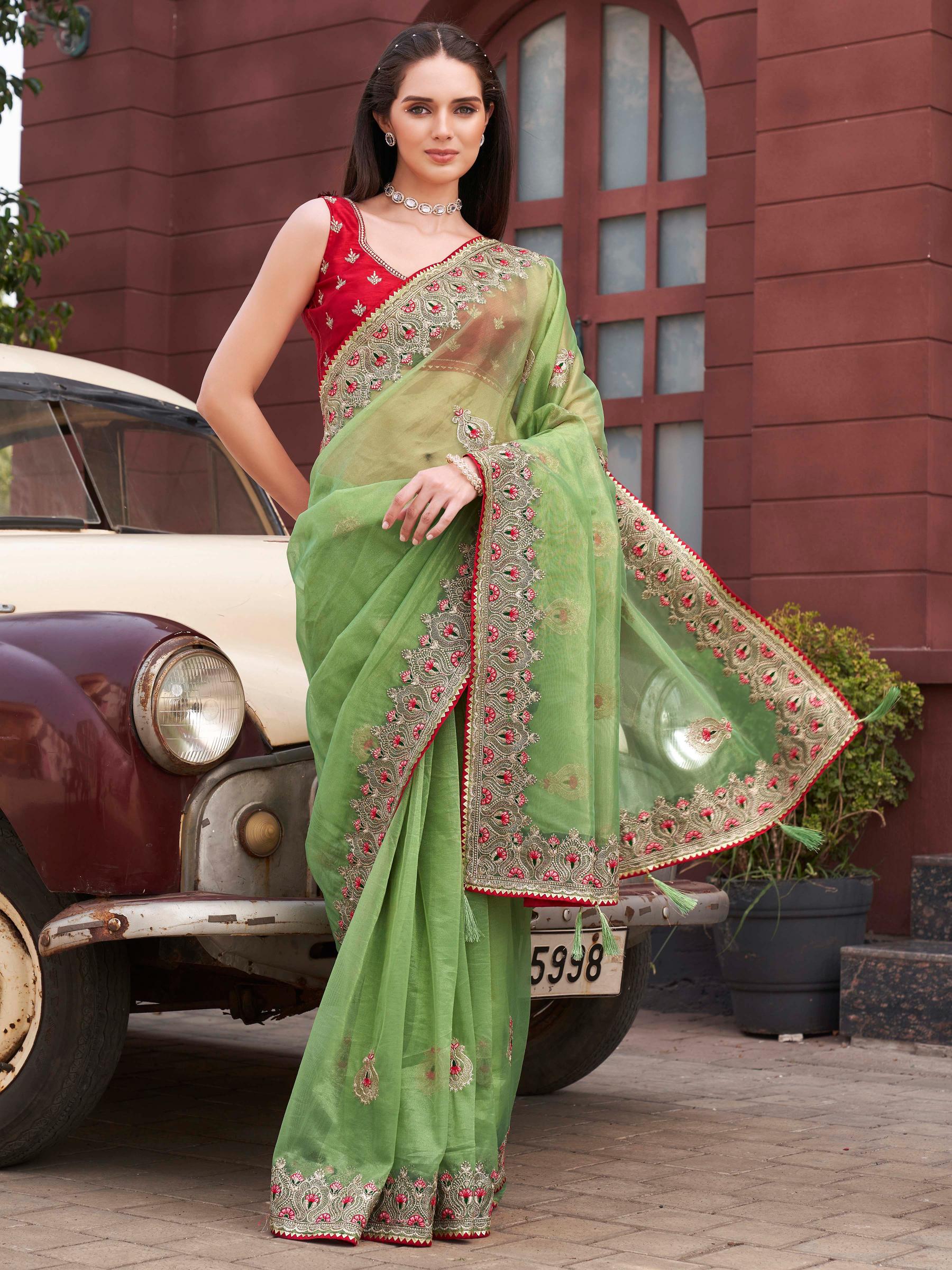 Green colored shimmer net embroidered saree