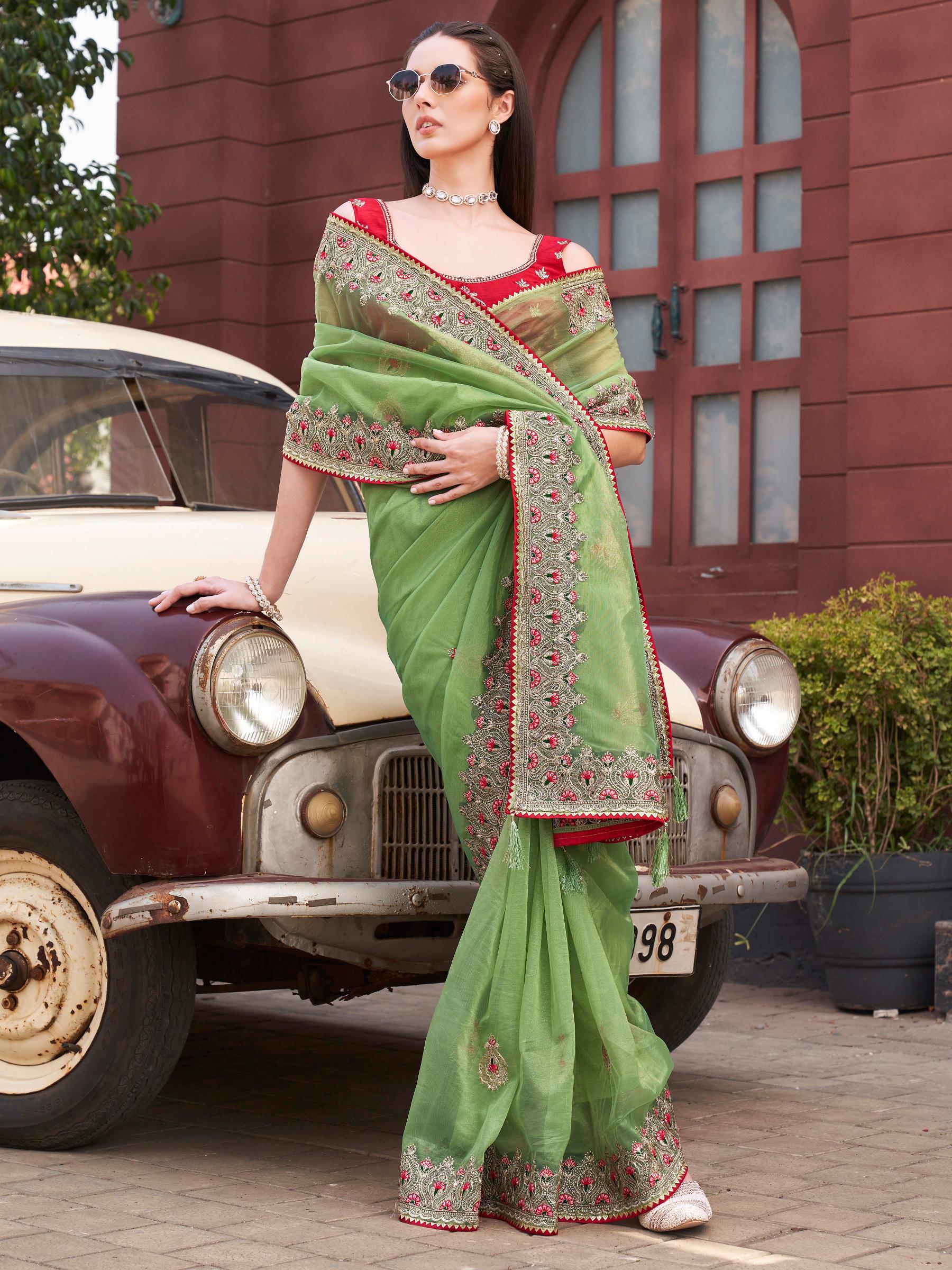 Green colored shimmer net embroidered saree