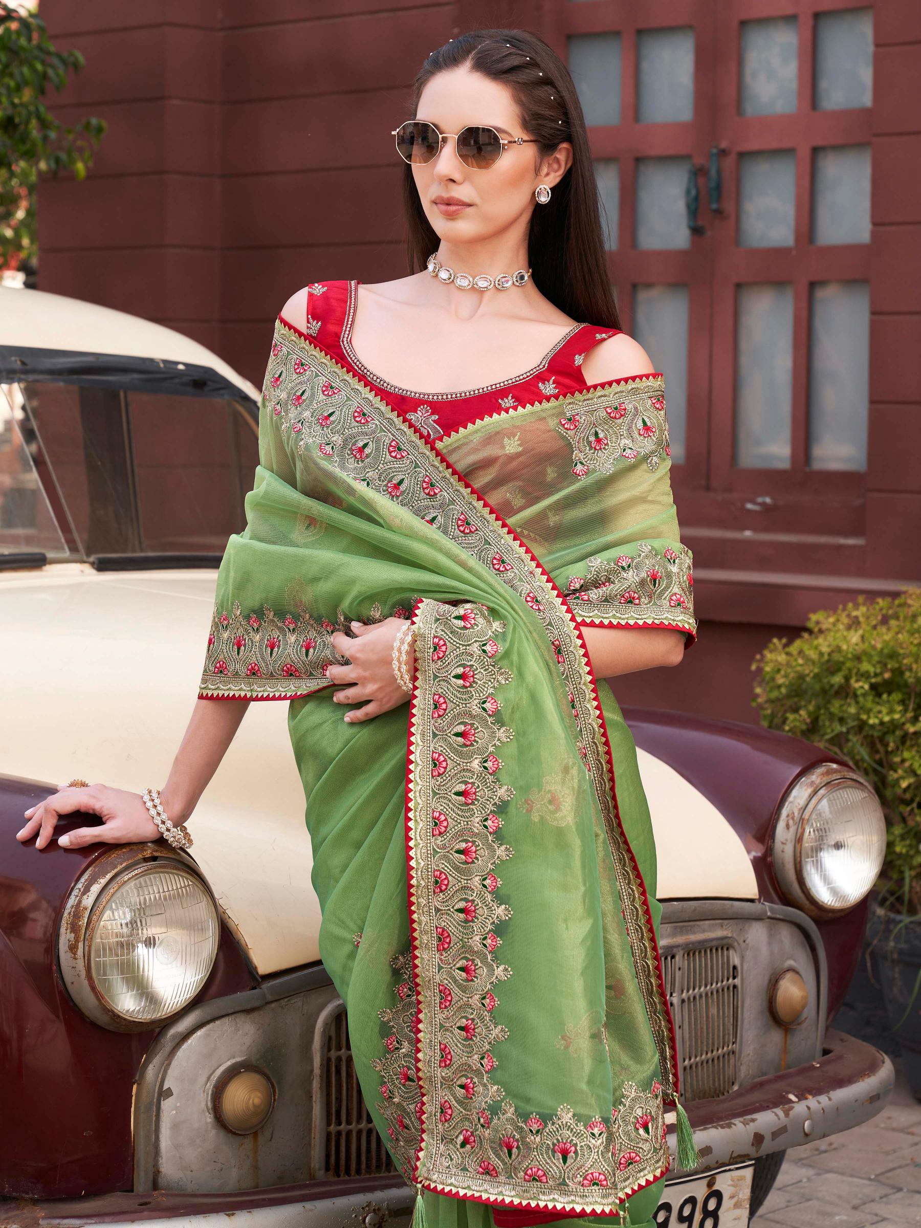 Green colored shimmer net embroidered saree