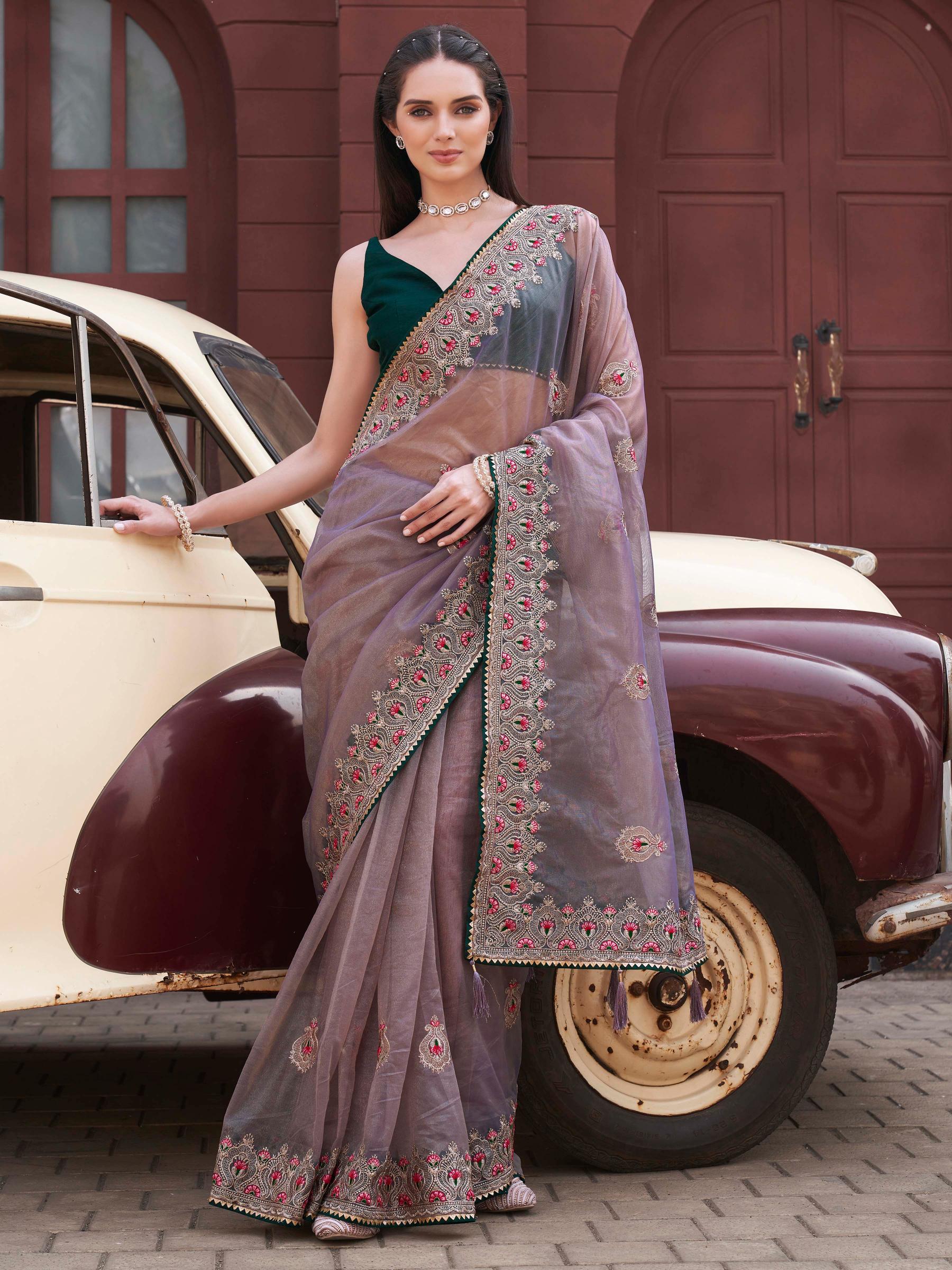 Mauve colored shimmer net embroidered saree