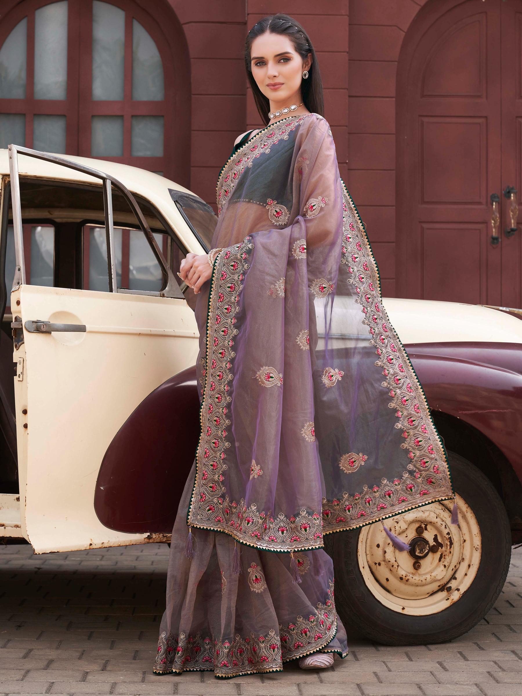 Mauve colored shimmer net embroidered saree