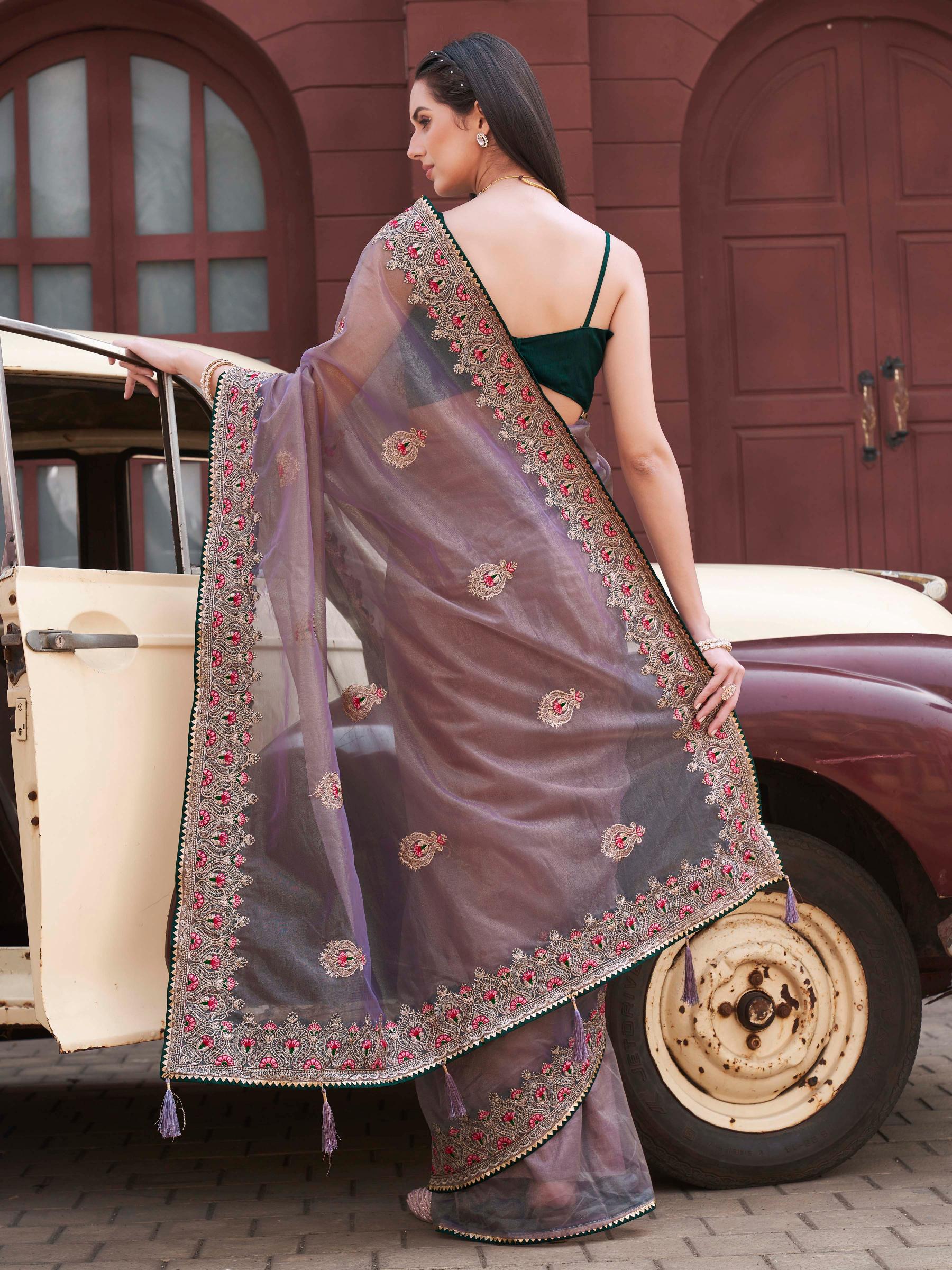 Mauve colored shimmer net embroidered saree