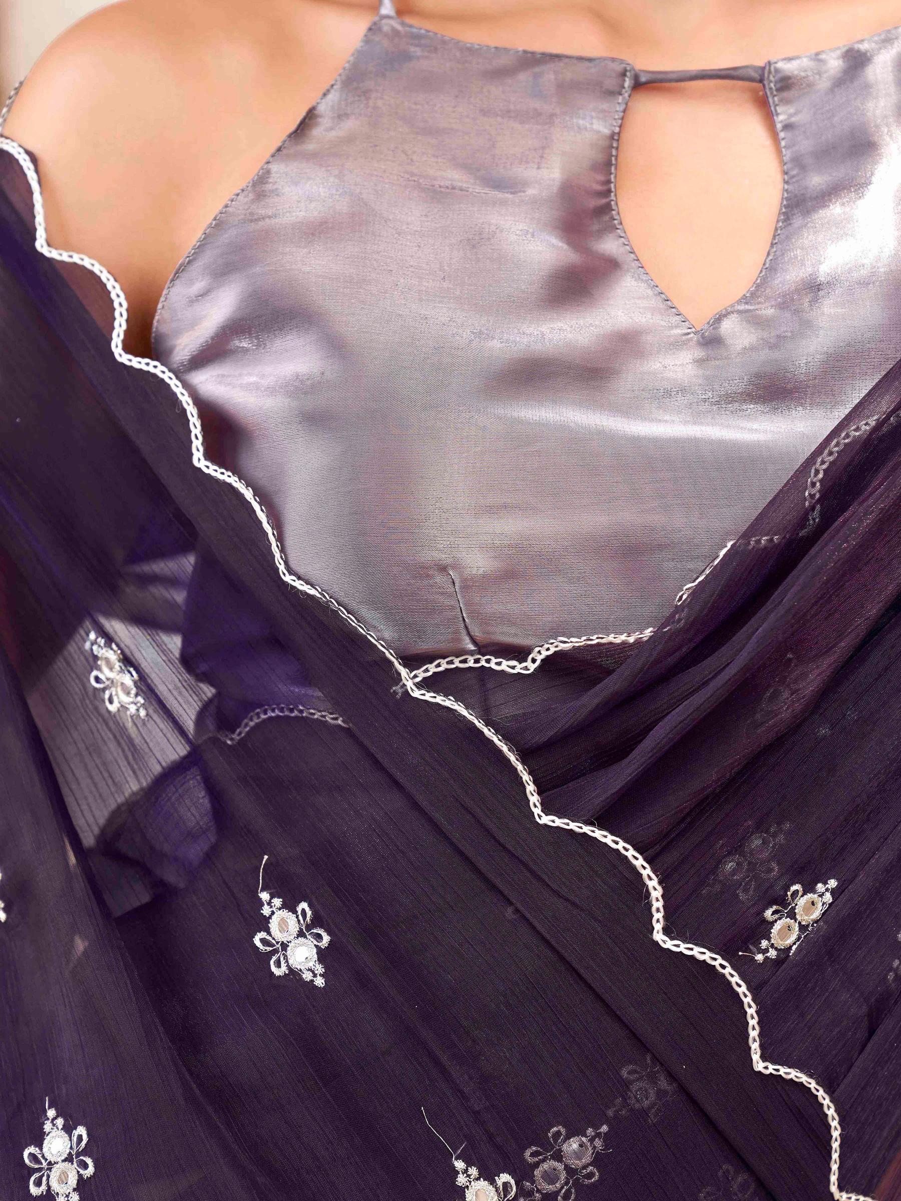 Purple colored saree with mirror embroidery on pallu and scalloped border