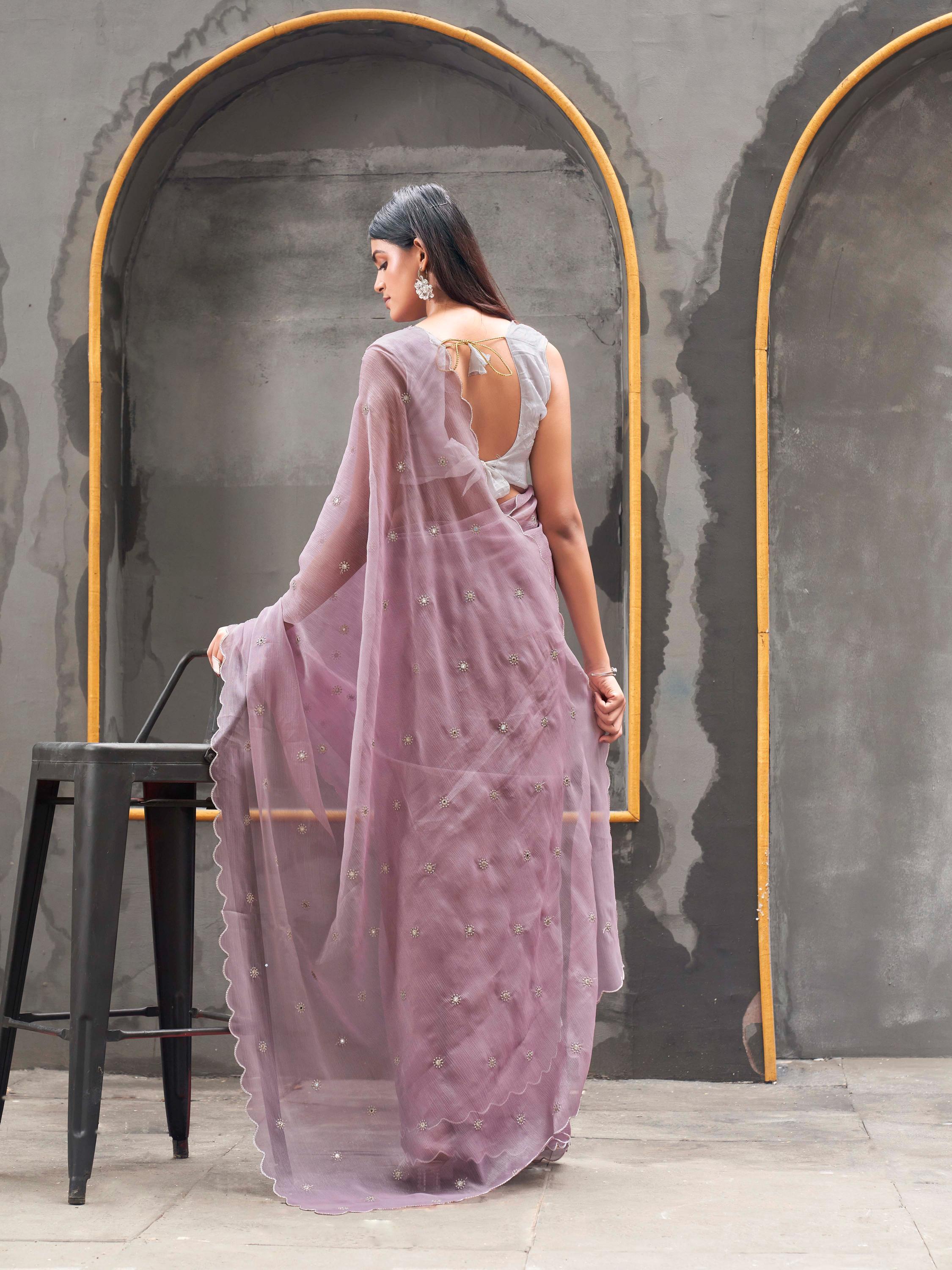 Mauve colored saree with mirror embroidery on pallu and scalloped border