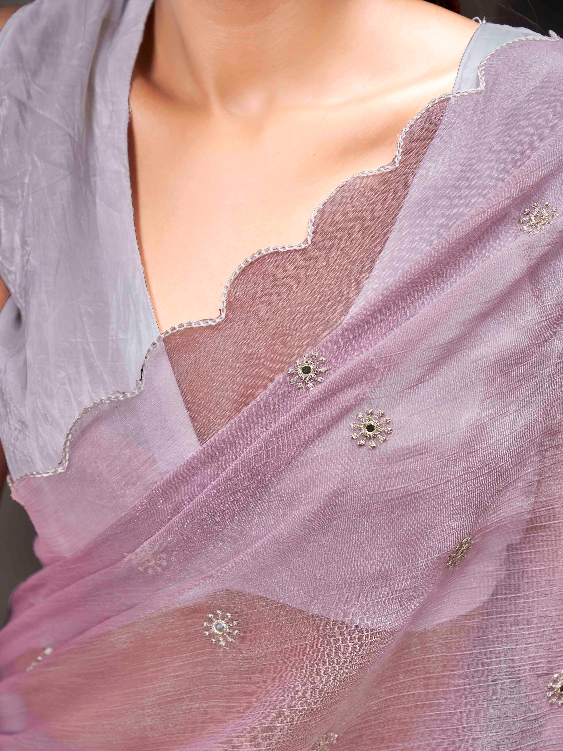 Mauve colored saree with mirror embroidery on pallu and scalloped border