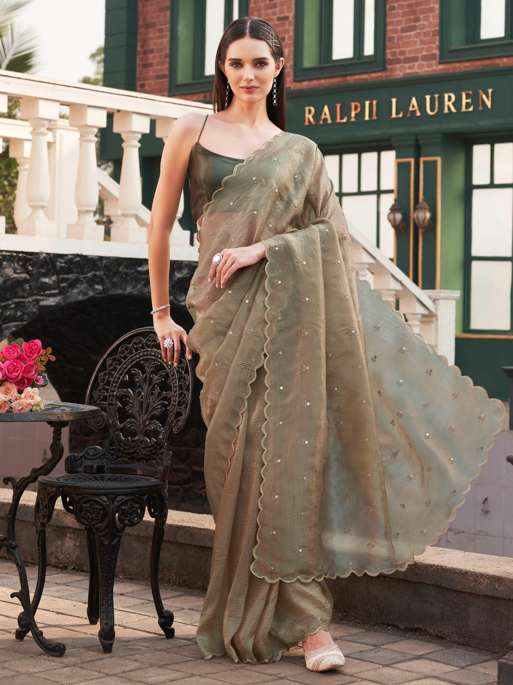 Chickoo colored crunchy saree with mirror embroidery on pallu and scalloped border