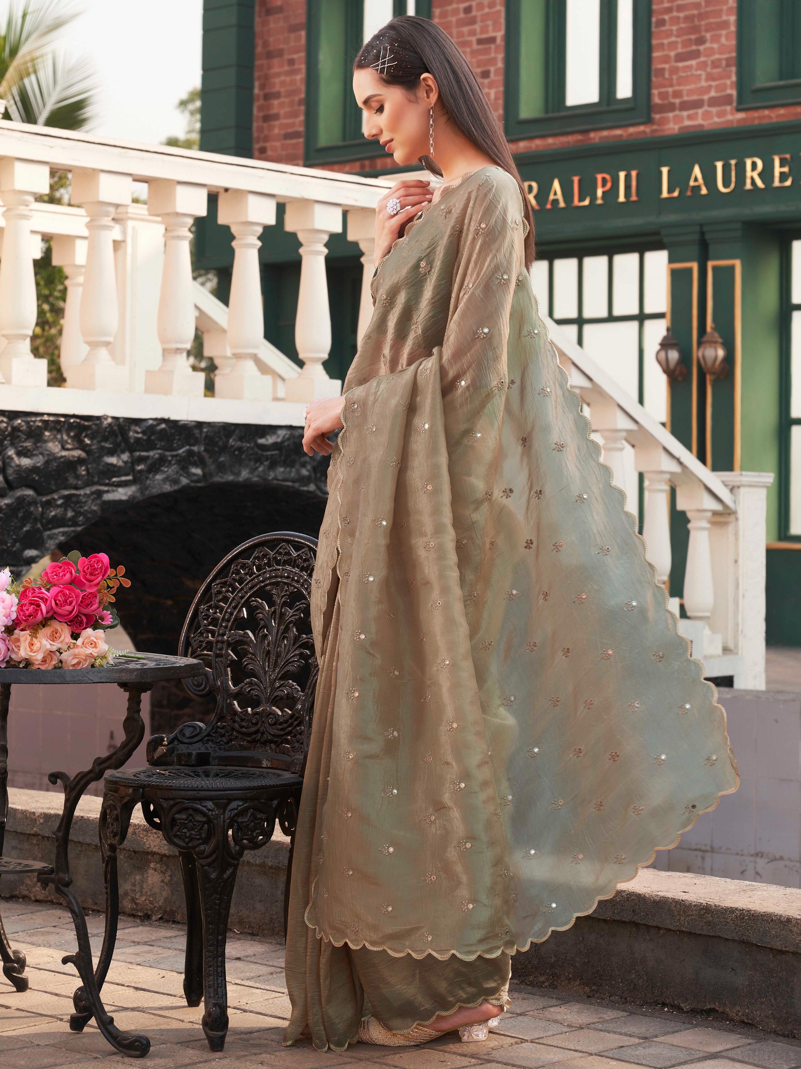 Chickoo colored crunchy saree with mirror embroidery on pallu and scalloped border