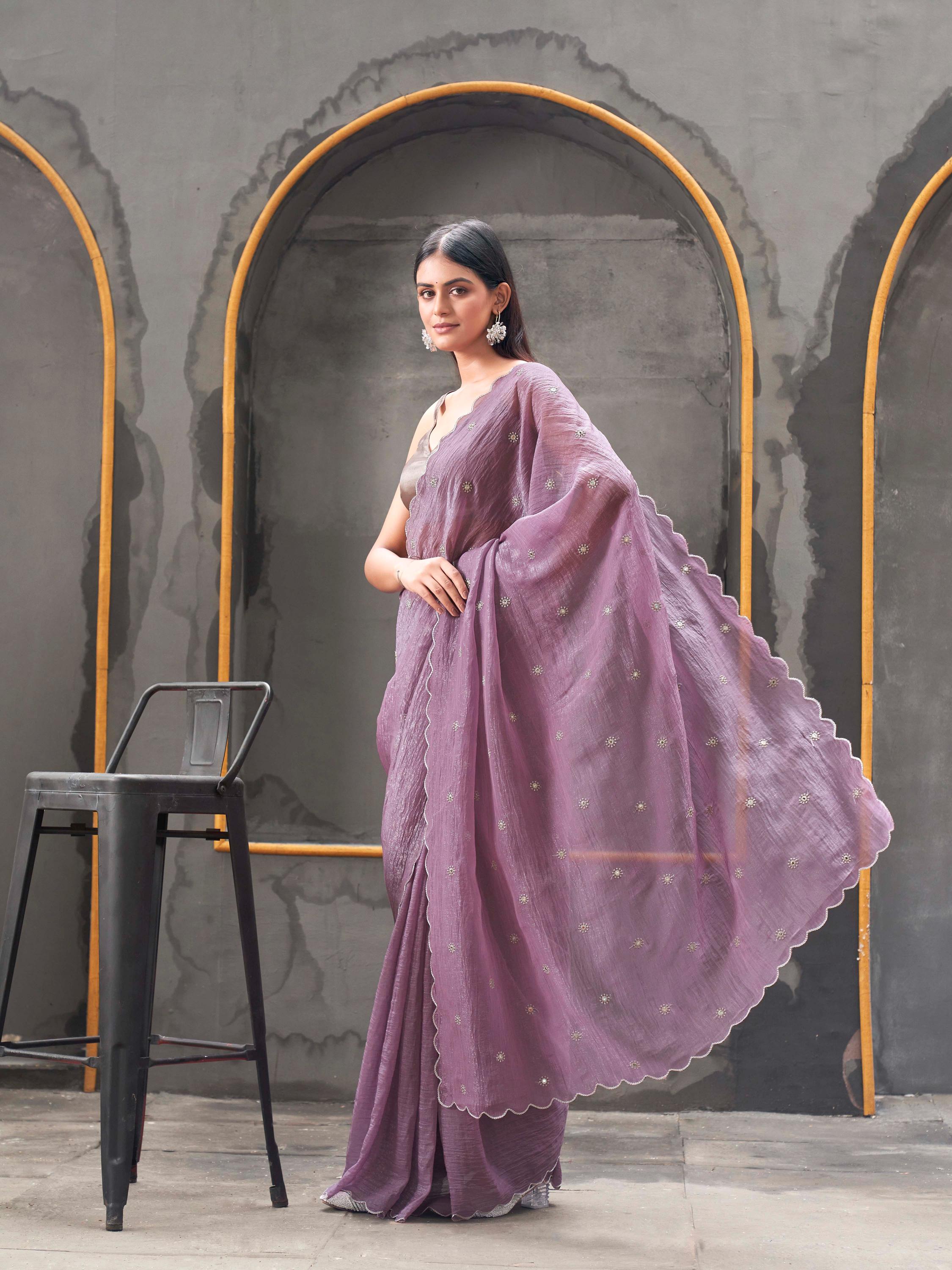 Mauve colored crunchy saree with mirror embroidery on pallu and scalloped border