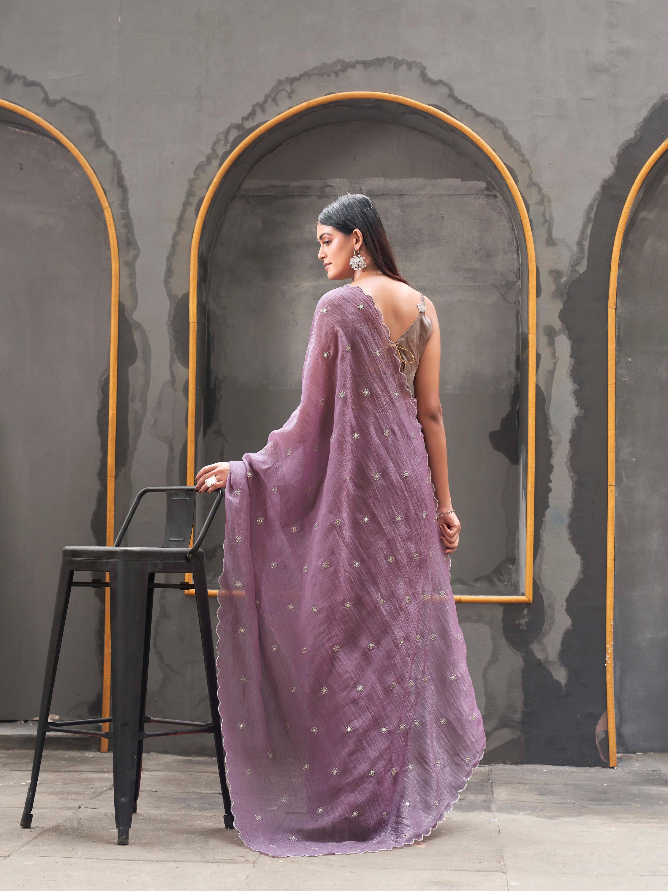 Mauve colored crunchy saree with mirror embroidery on pallu and scalloped border