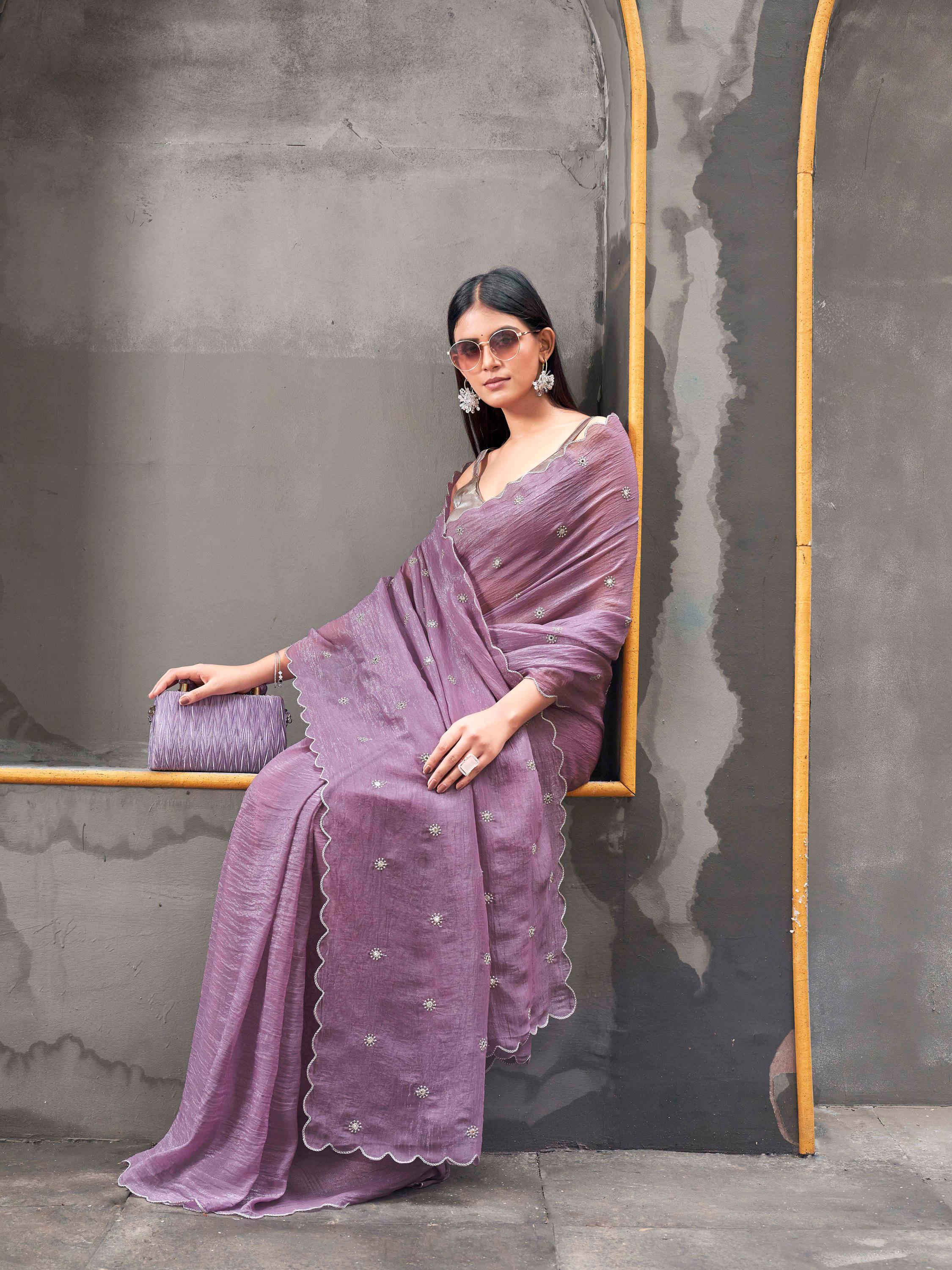 Mauve colored crunchy saree with mirror embroidery on pallu and scalloped border