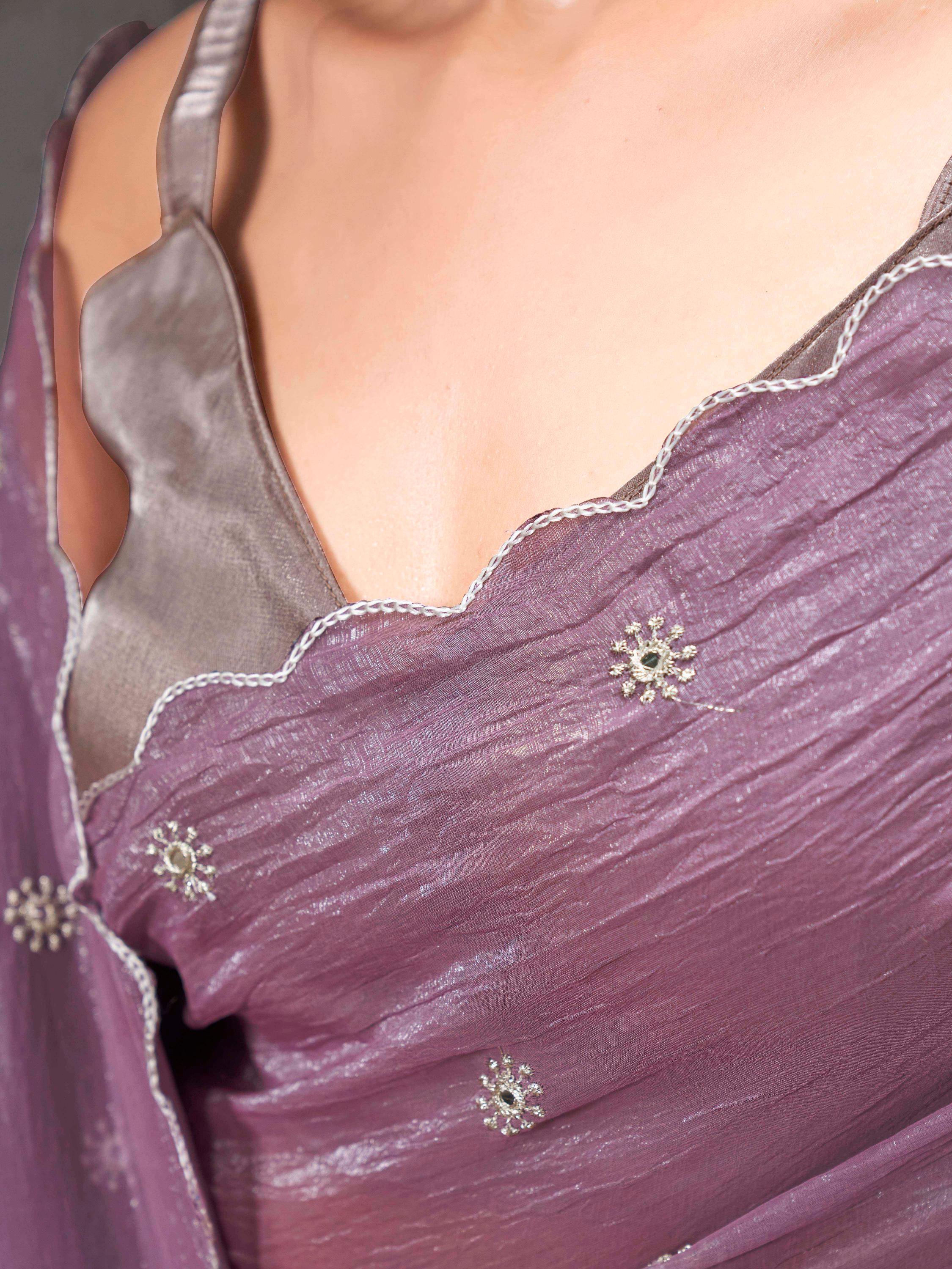 Mauve colored crunchy saree with mirror embroidery on pallu and scalloped border