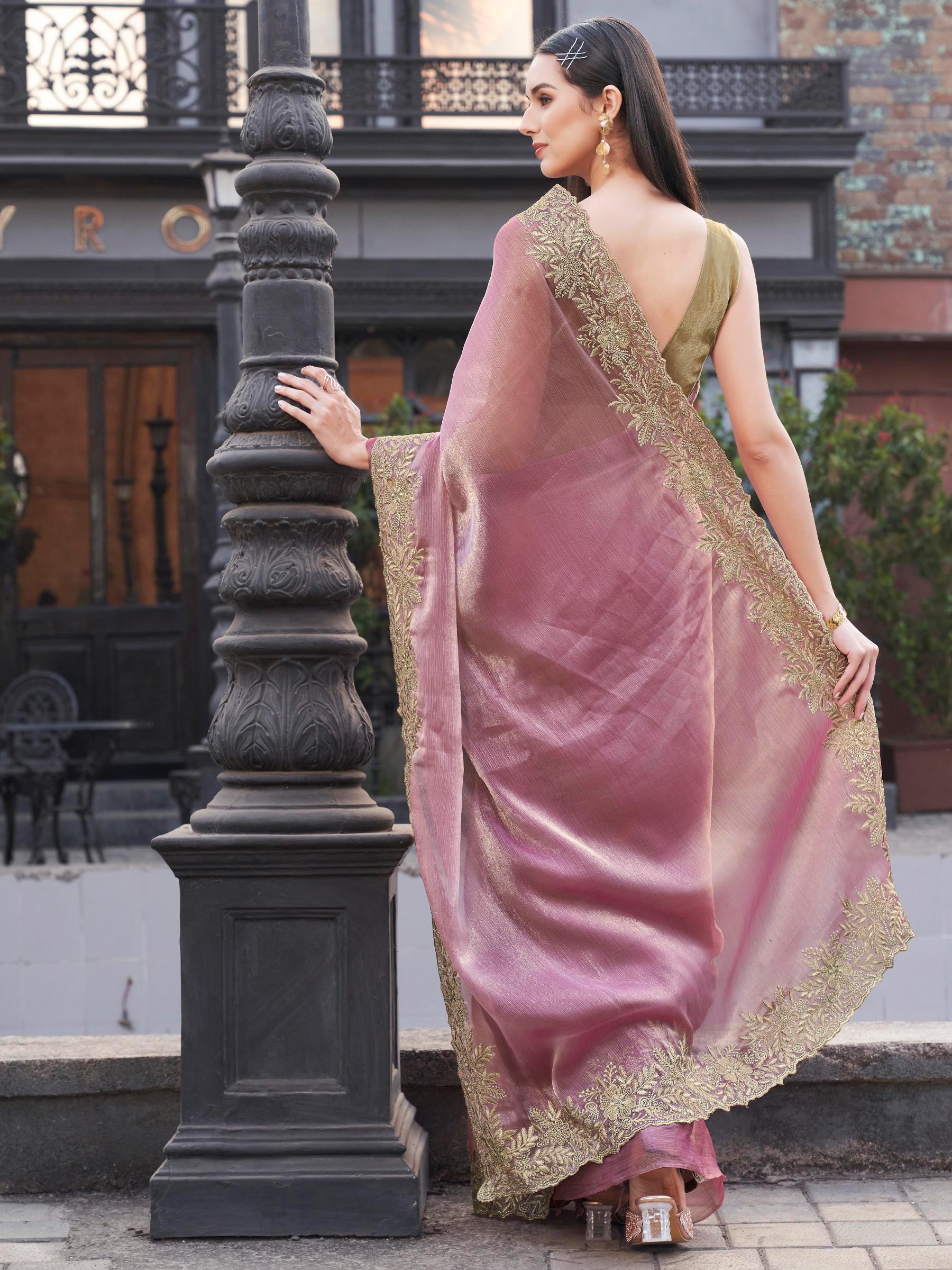Pink colored zari embroidered saree