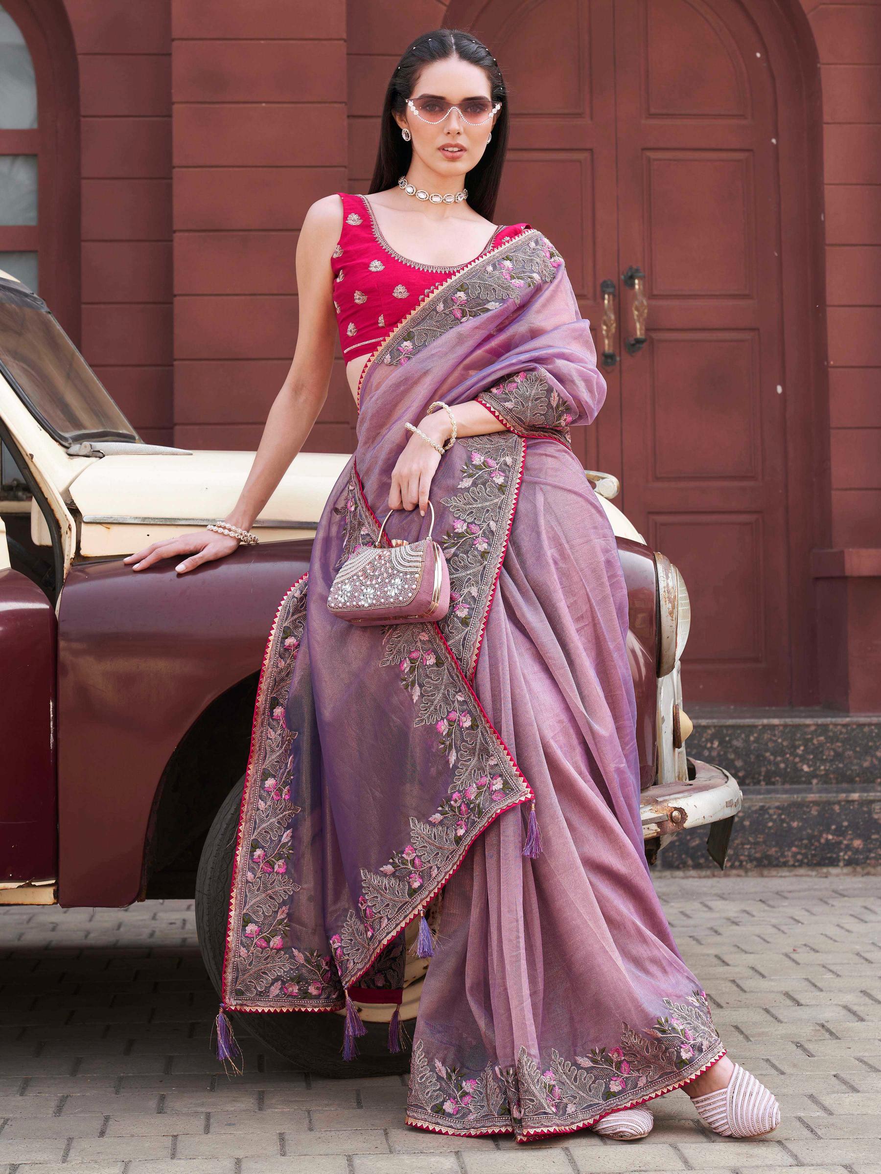 purple colored designer shimmer net embroidered saree
