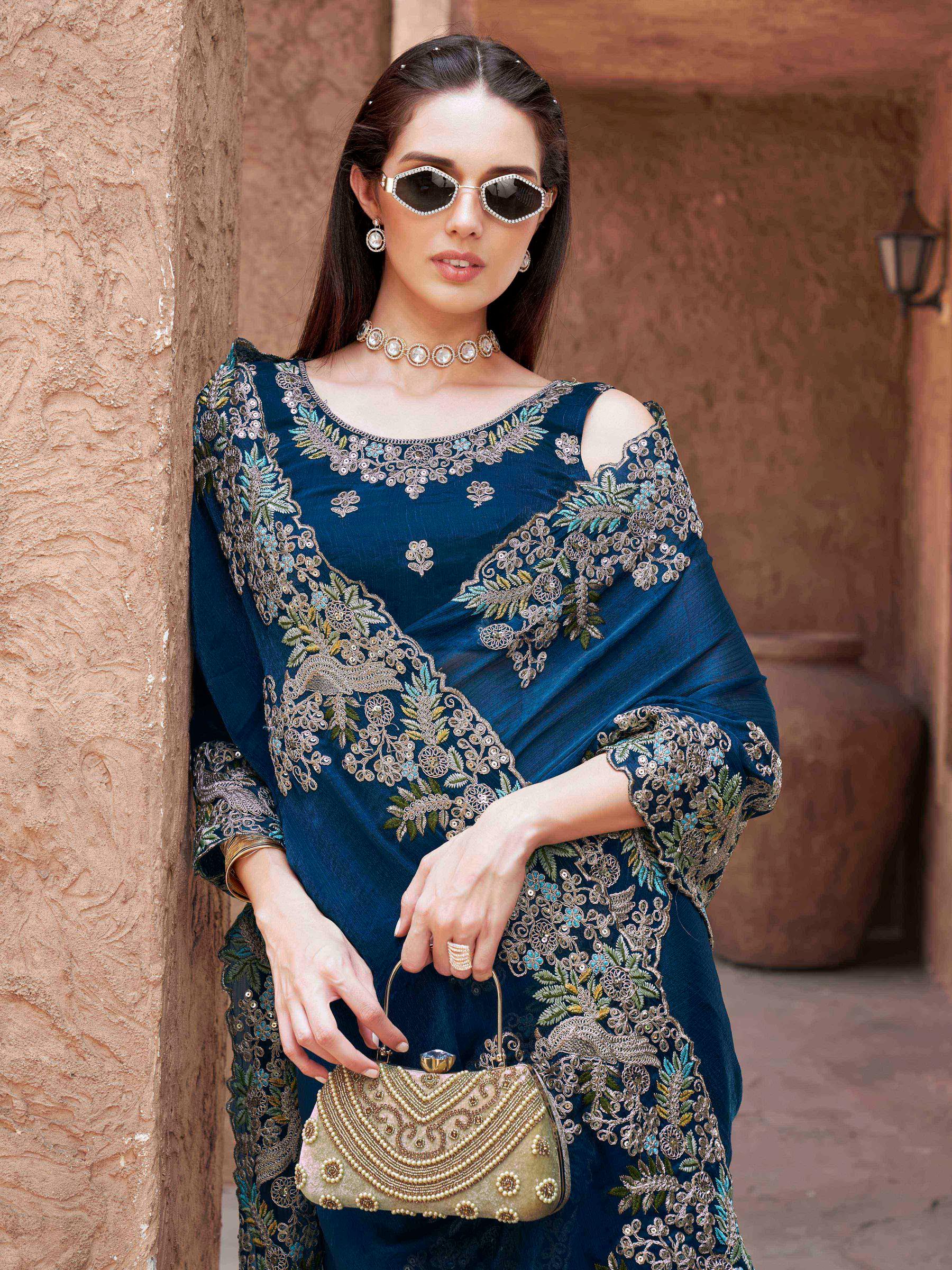 teal colored designer jimmy choo saree with sequinned embroidery border