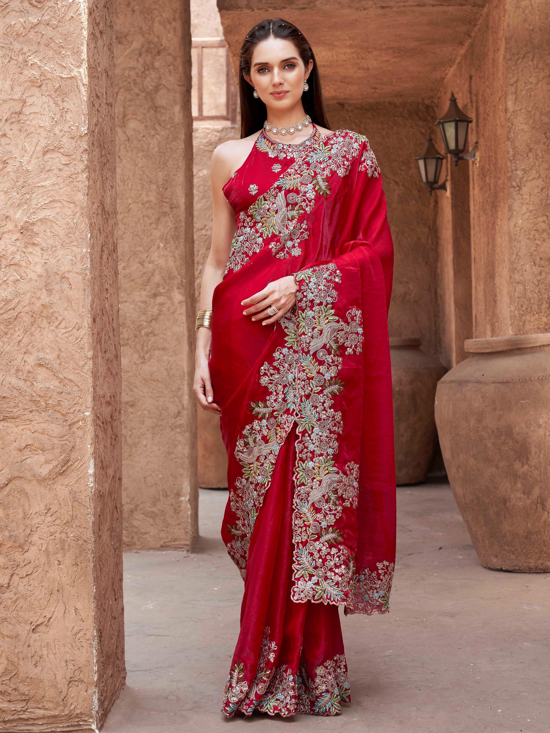 red colored designer jimmy choo saree with sequinned embroidery border