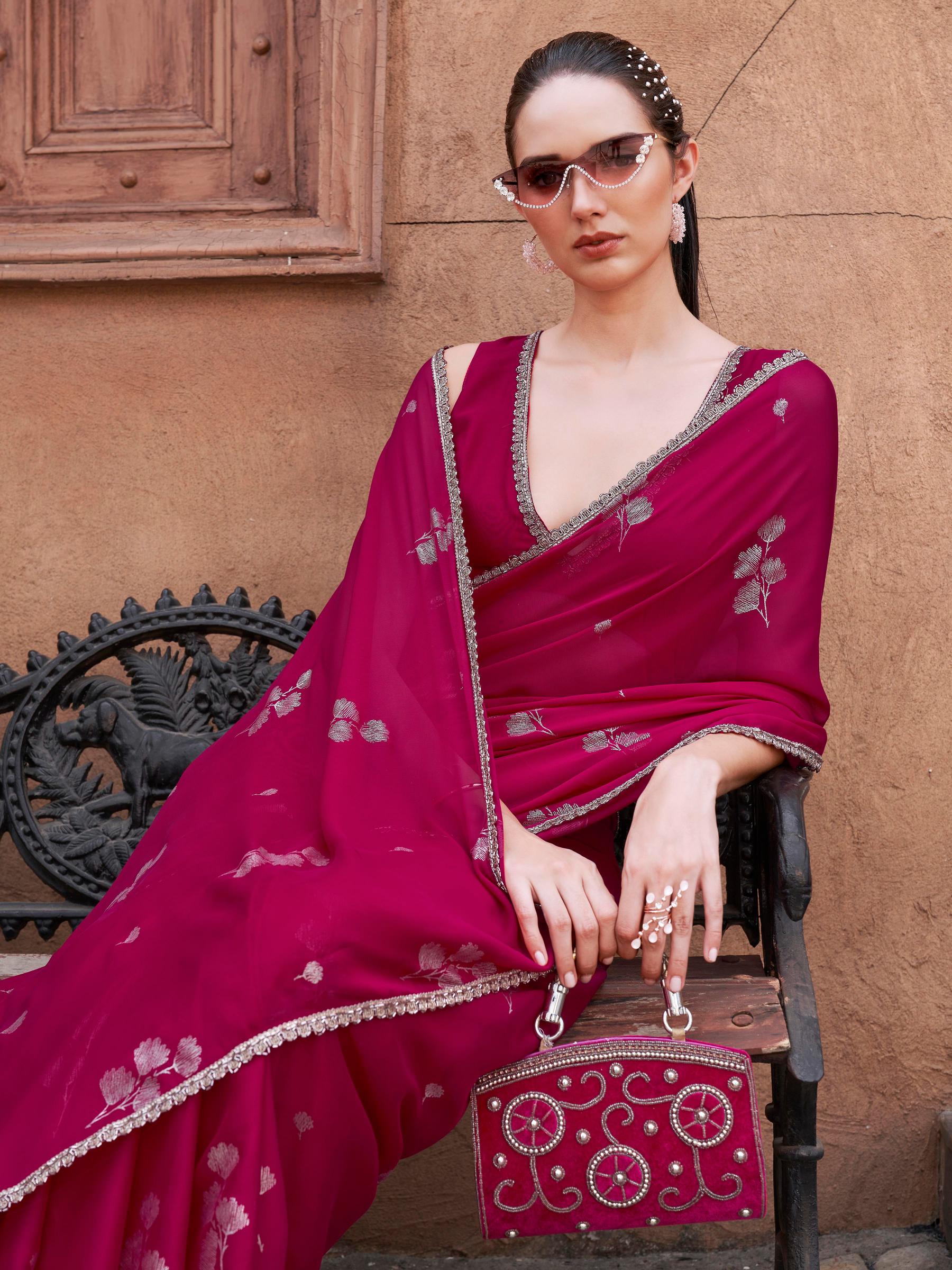 Pink colored designer saree with foil embellishment and embellished lace