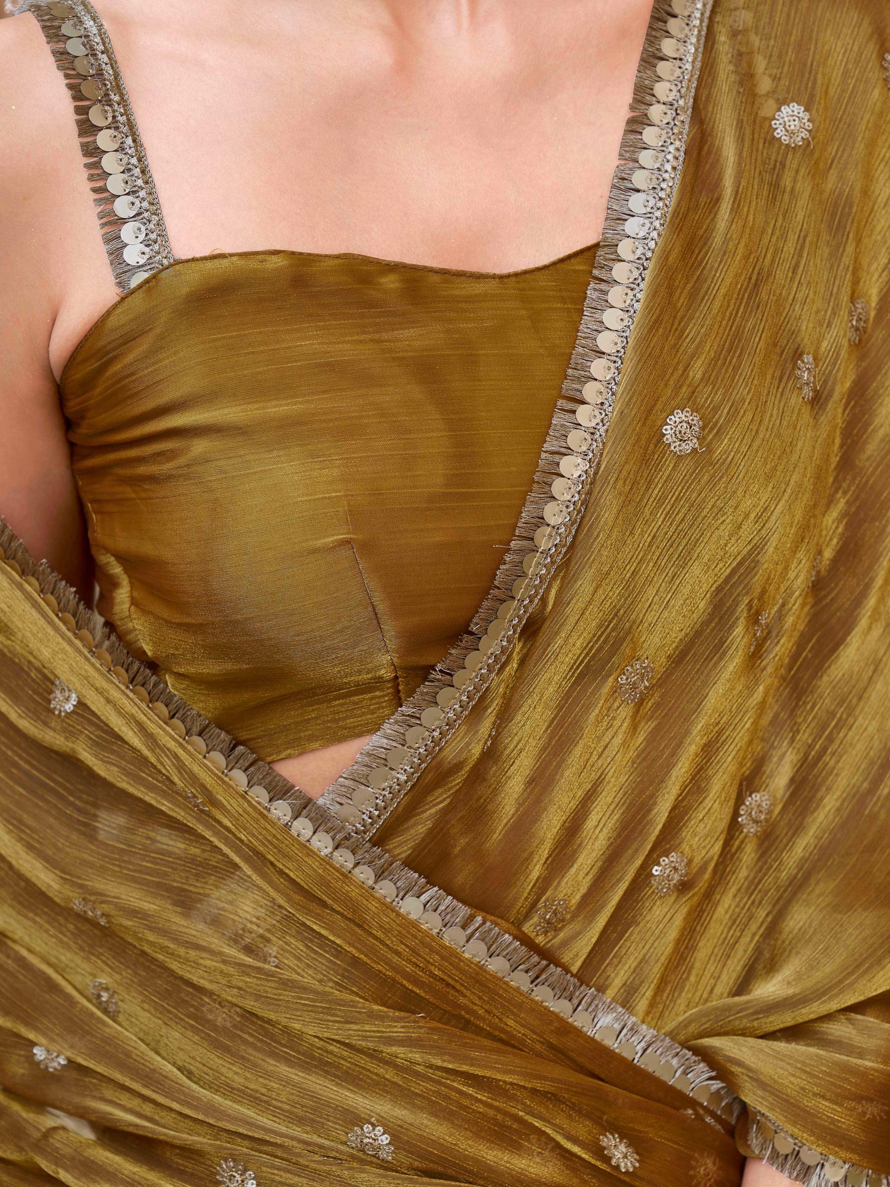 Gold colored jimmy chooo saree with sequinned butti and embroidered border