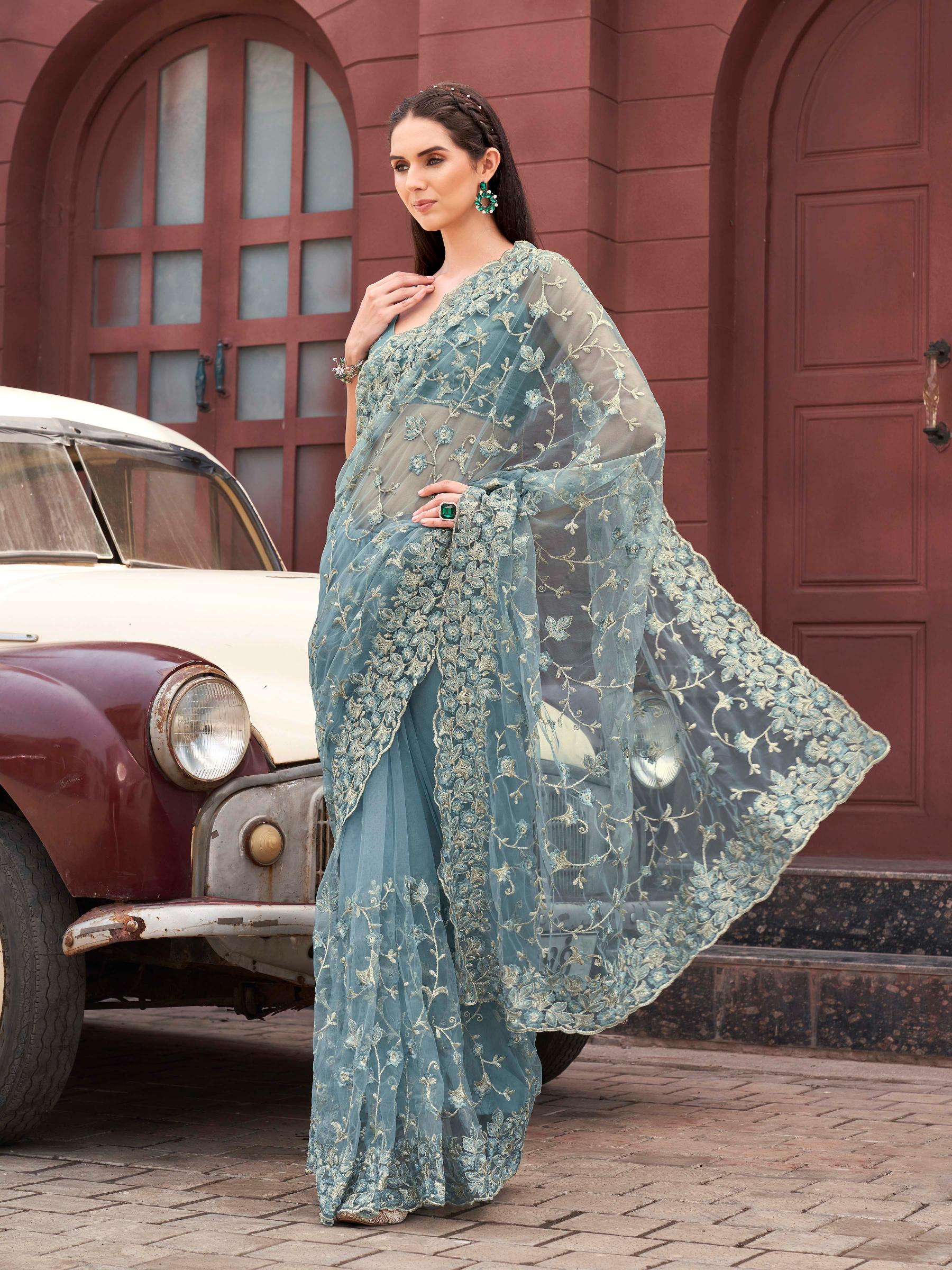 Blue colored embroidered net saree