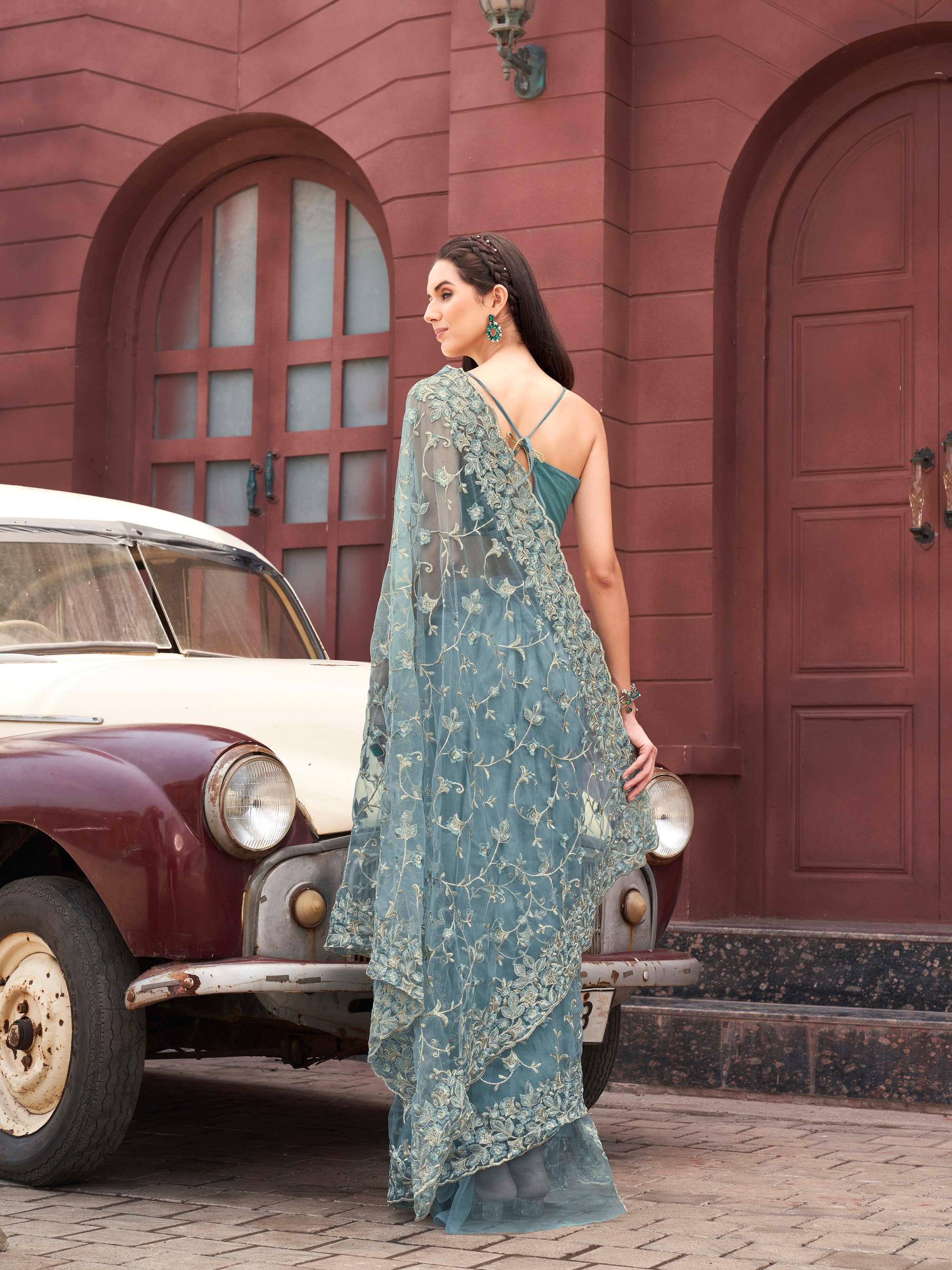 Blue colored embroidered net saree