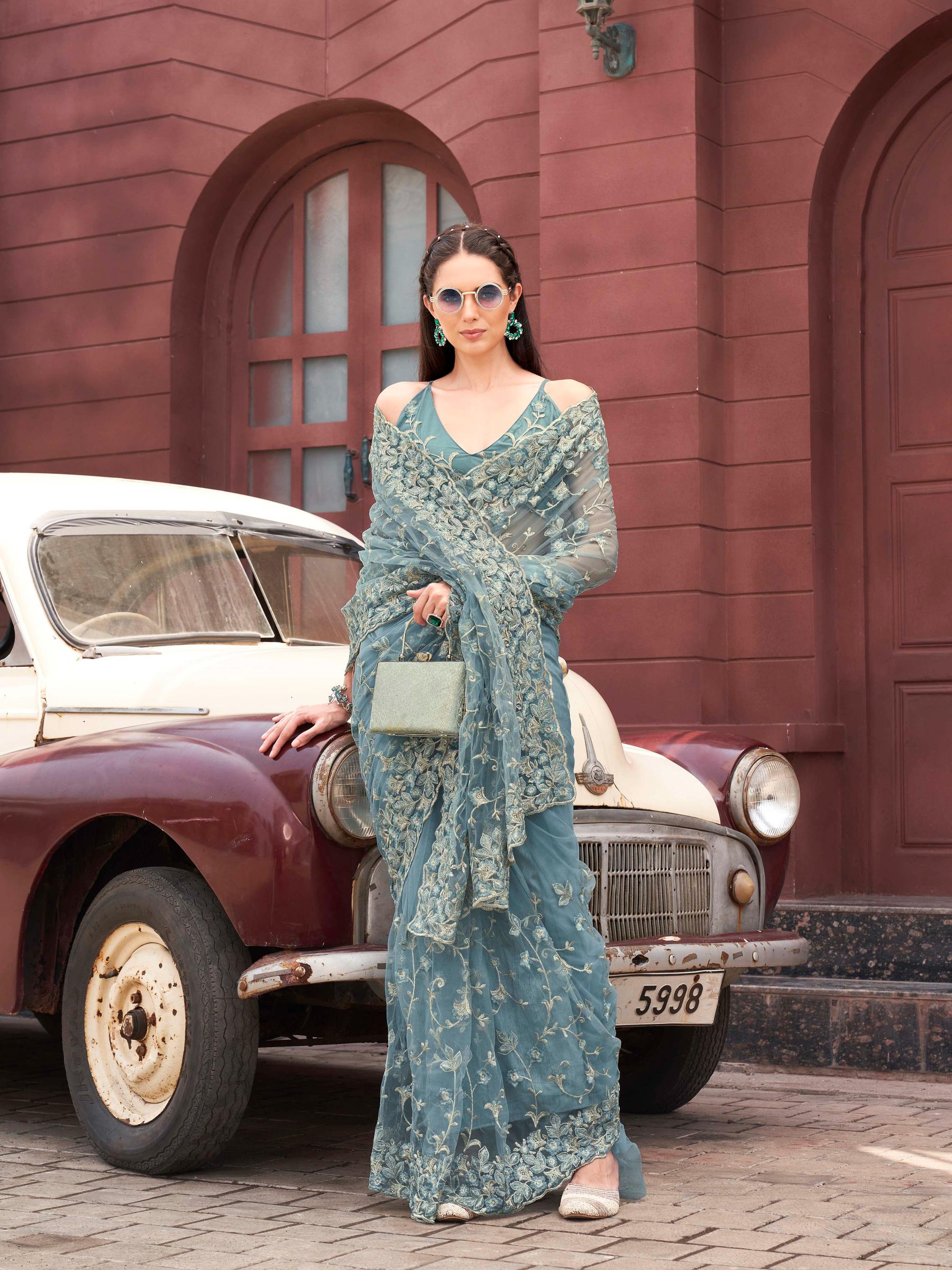 Blue colored embroidered net saree