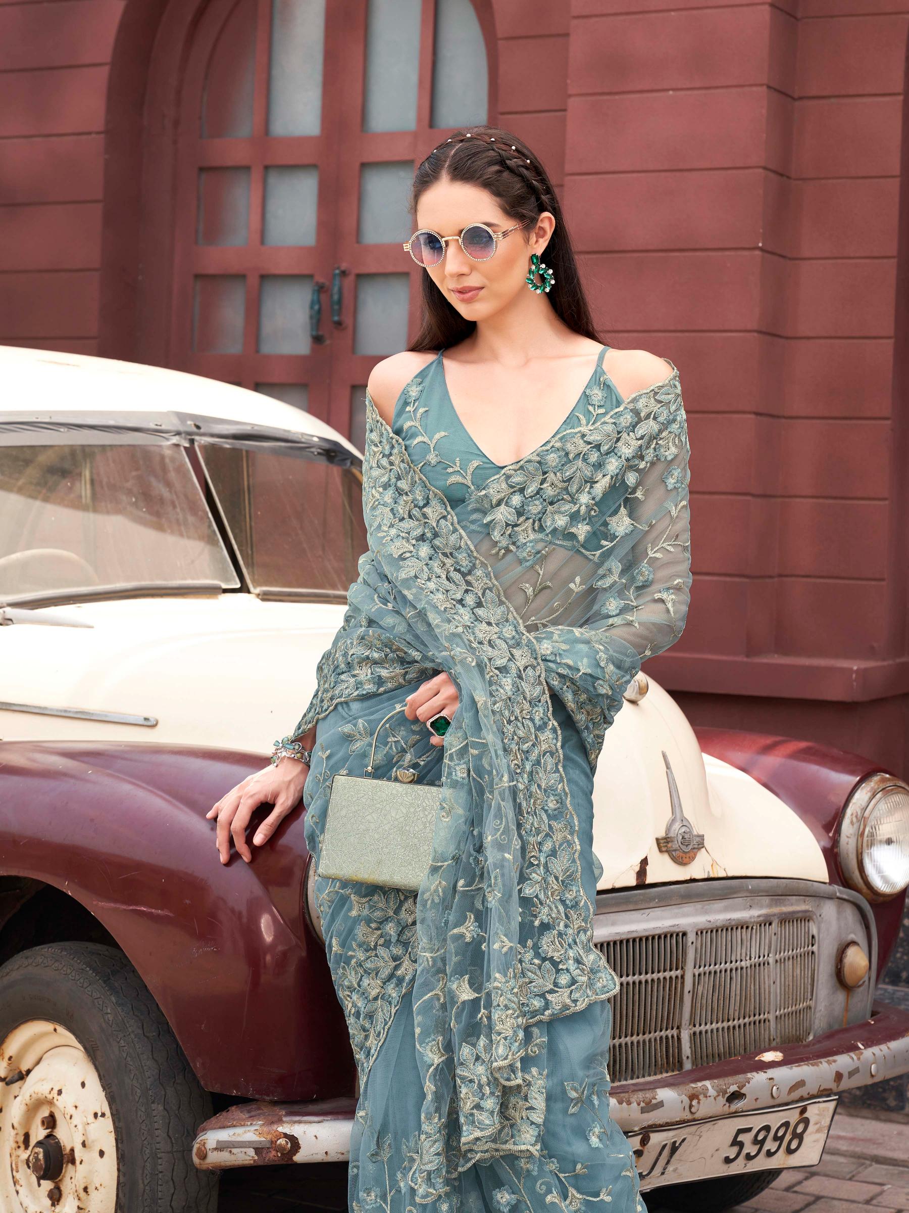 Blue colored embroidered net saree