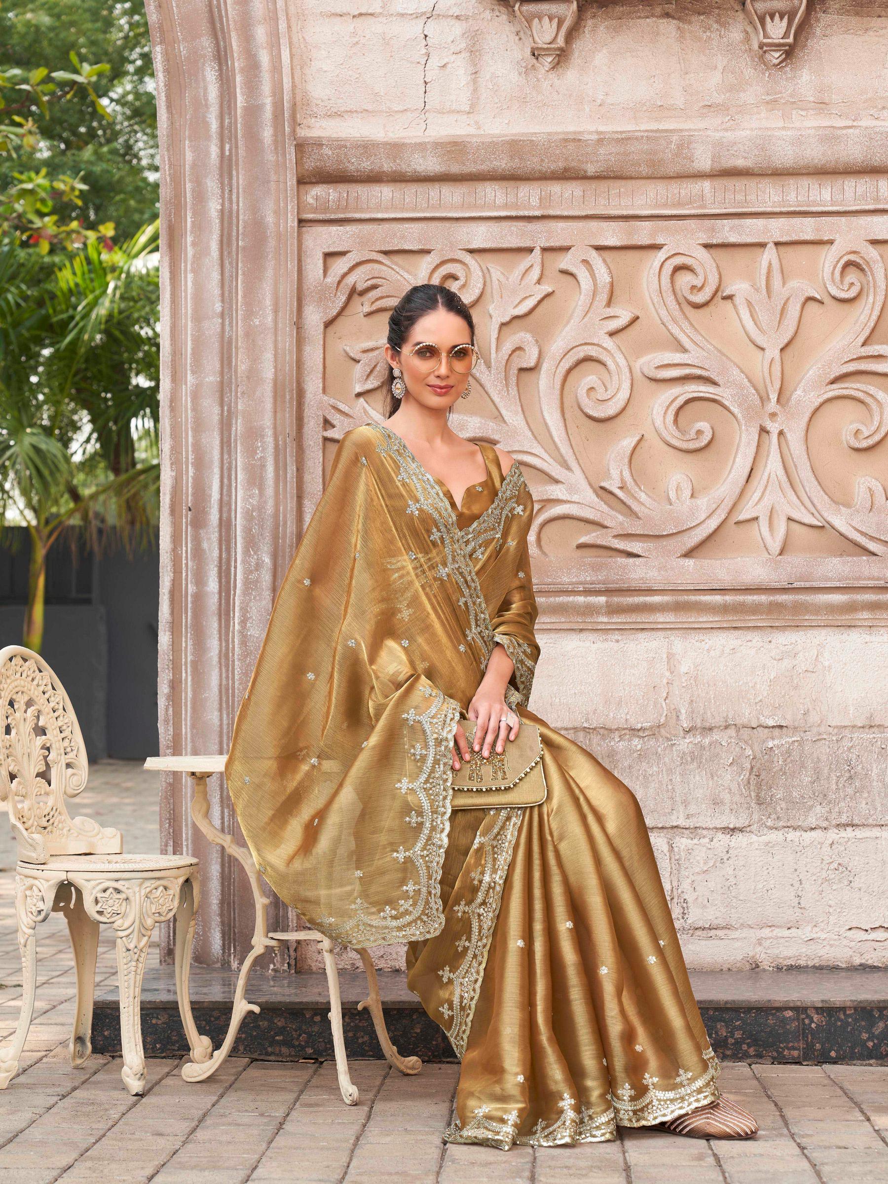 Gold colored jimmy chooo sequinned embroidered saree