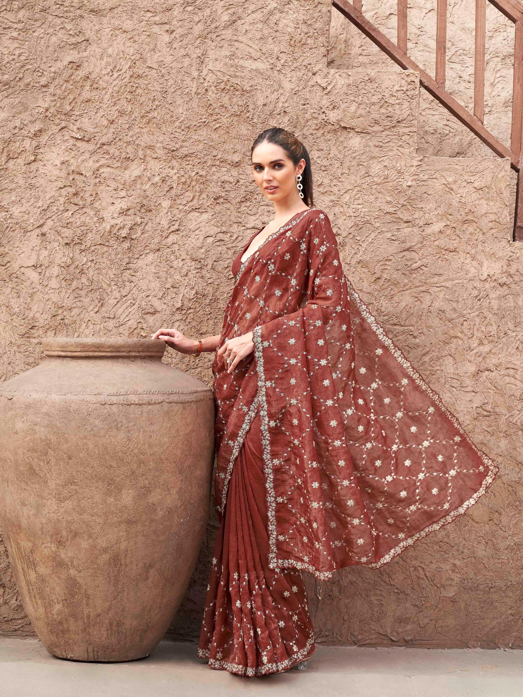 Rust colored crunchy saree with pitha embroidered work