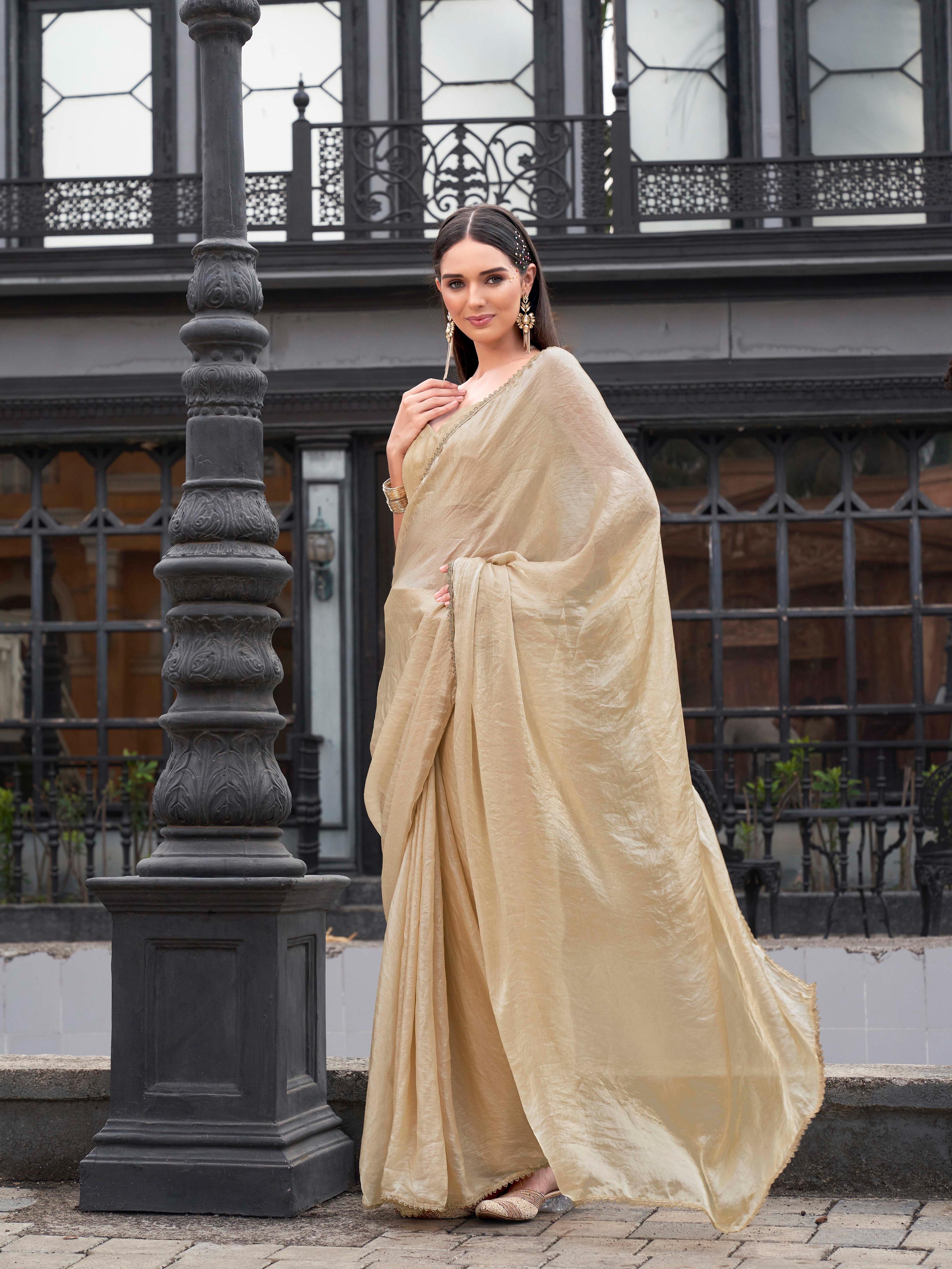 Ready to wear beige colored jimmy choo saree with embellished lace