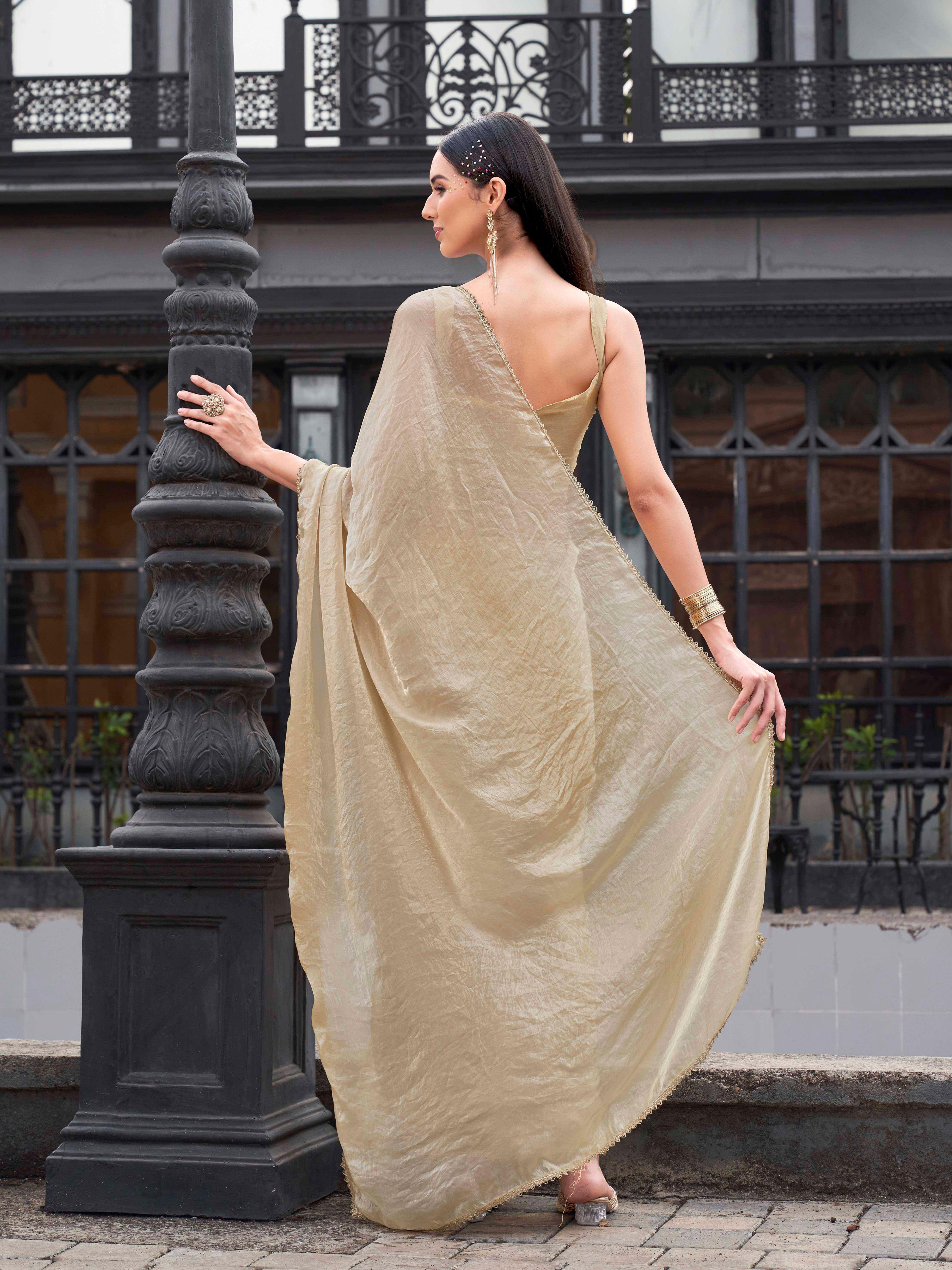 Ready to wear beige colored jimmy choo saree with embellished lace