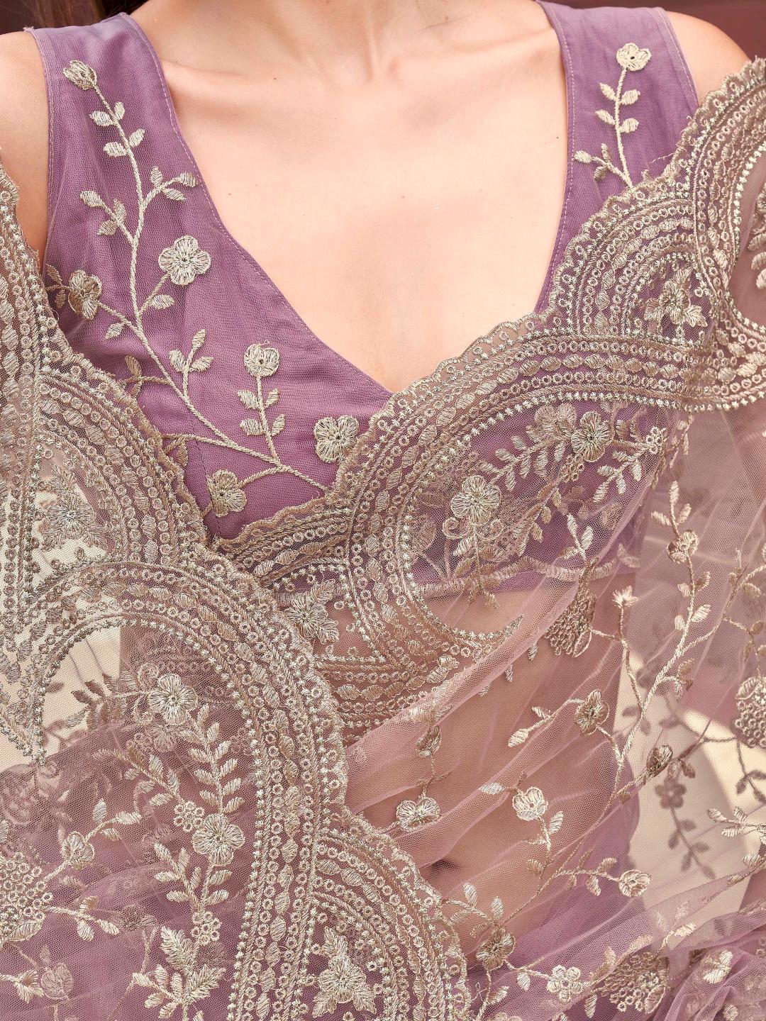 Pink colored embroidered net saree