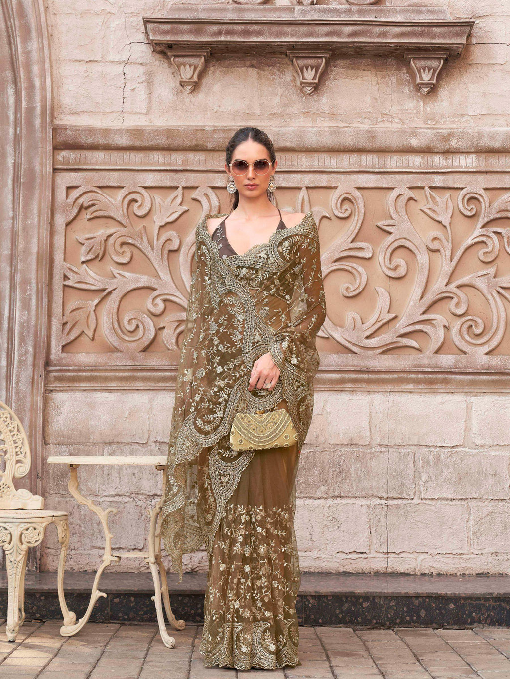 Brown colored embroidered net saree