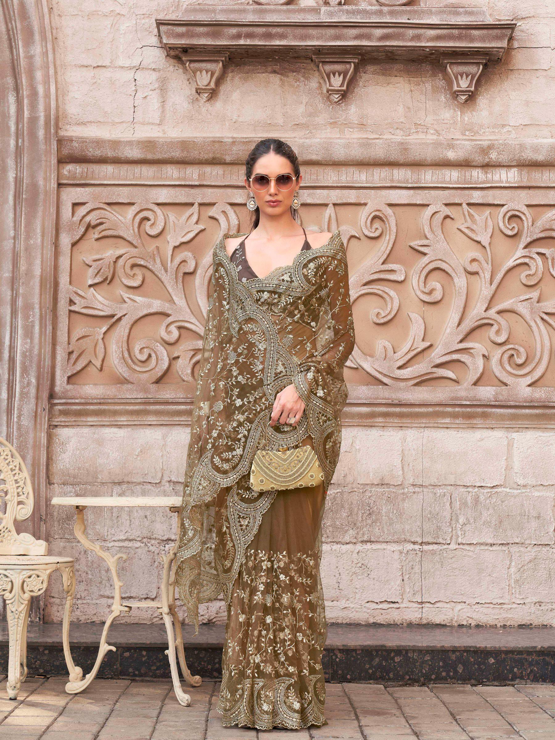 Brown colored embroidered net saree