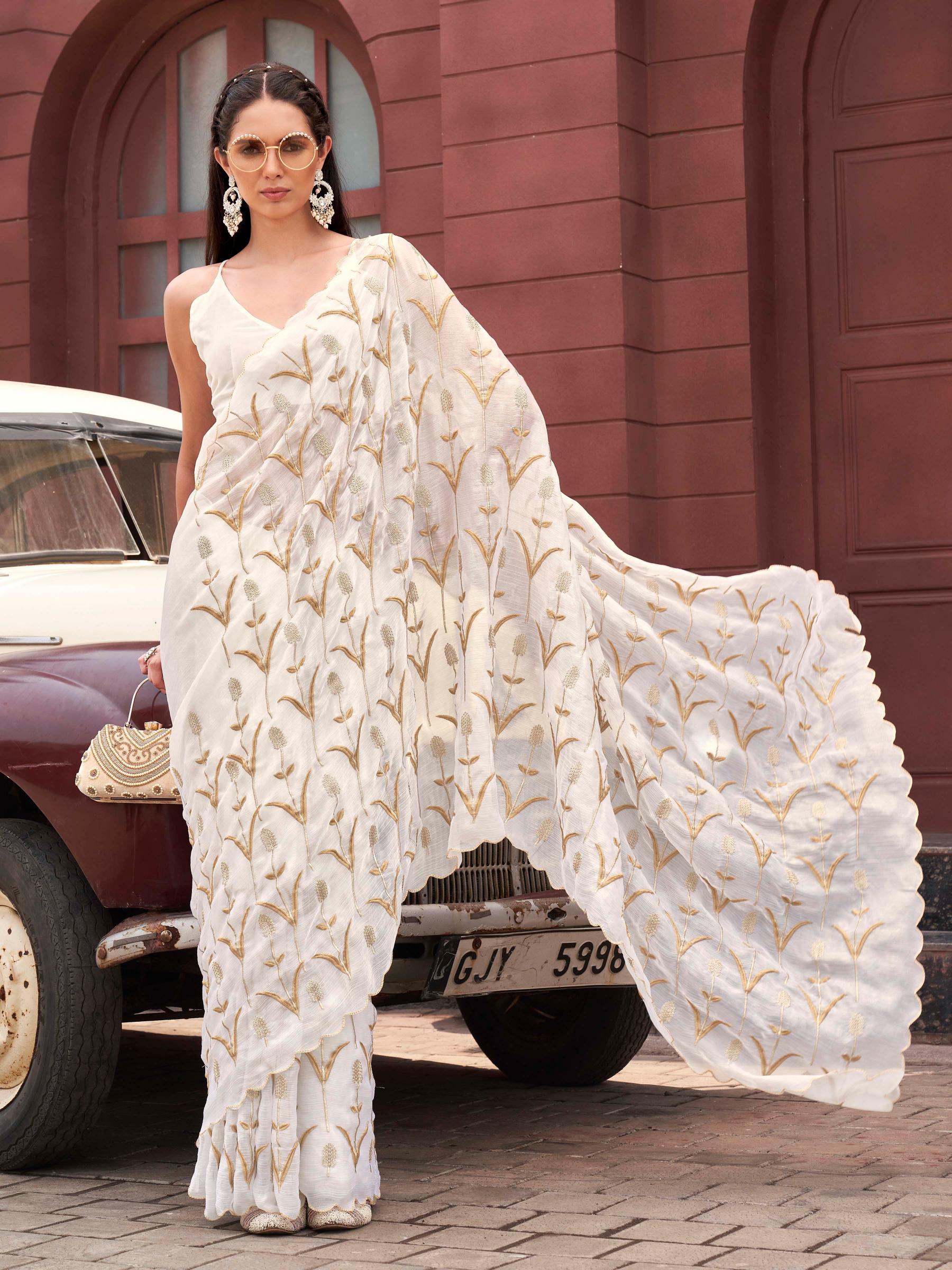 White colored jimy cho embroidered saree with scalloped border