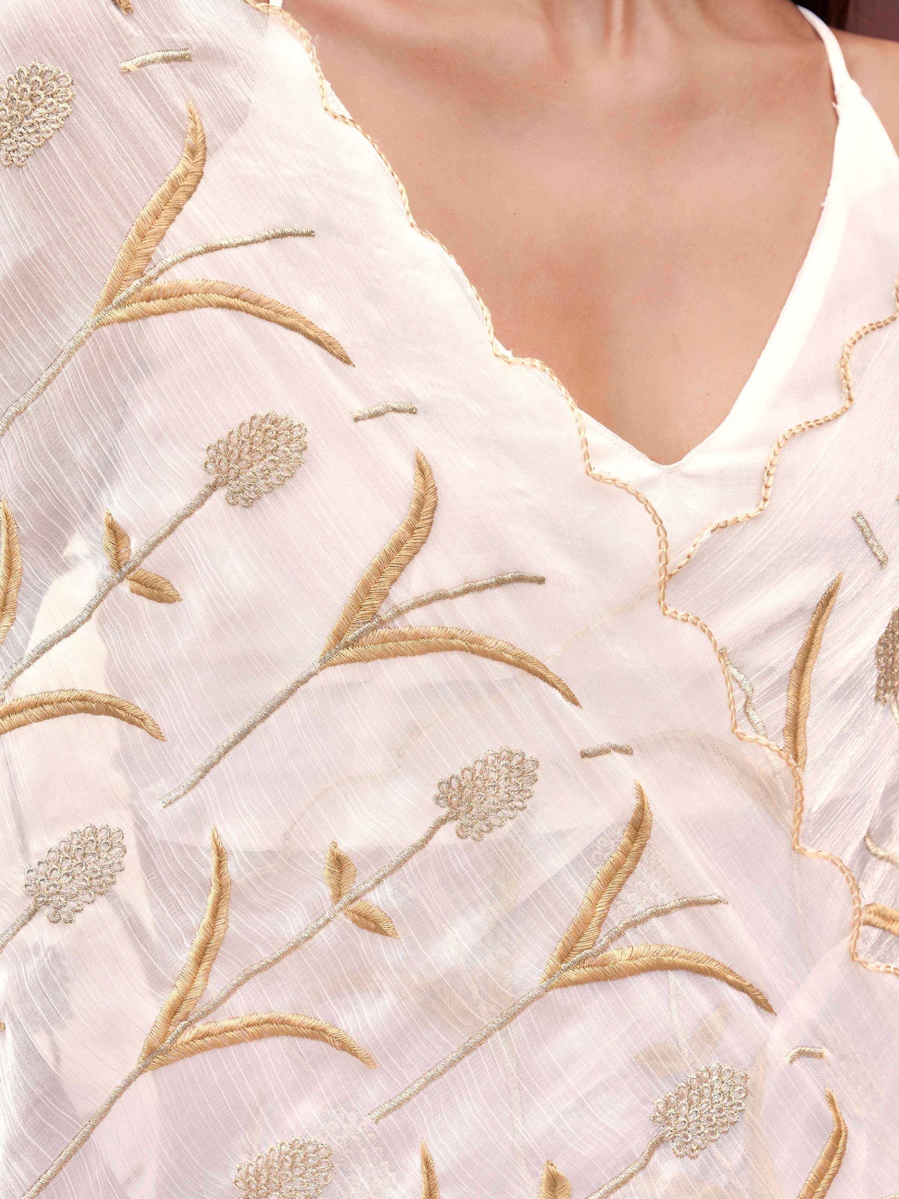 White colored jimy cho embroidered saree with scalloped border