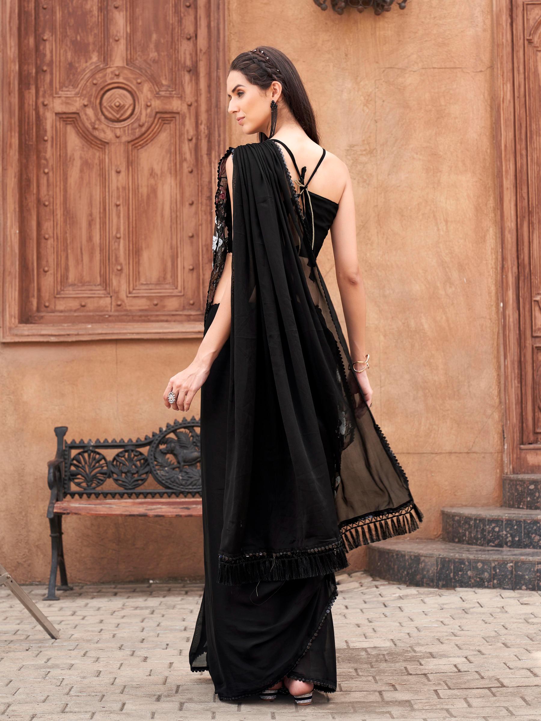 Black colored designer saree with sequence and beads embroidery on shoulder portion